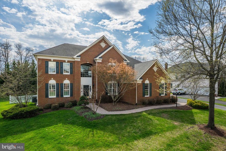 Classic Colonial from the Estate Series Collection.  This Very Popular Somerset Model is Sited on a Private (almost 1/2 Acre) Lot, Backing to Trees!   The Two Story Foyer with Curved Staircase Greets You!  As you Enter, You're Quickly Drawn to the Floor Plan and Features!  Custom Built Office Bookcase & Desk!  Gourmet Kitchen with Solarium Addition!  Light Filled Two Story Family Room with Wood Burning Fireplace (Gas Conversion Available)!   Large Bedrooms!  Unfinished Basement Awaits Your Custom Finish!  Entertain or Relax on the Brick Paver Patio!  Let the Kids or Dogs Play in the Fenced Backyard!  Great Home on a Great Lot!  Belmont Country Club Living, Priceless!