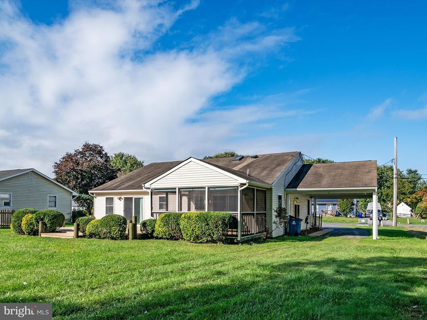 PRICE CHANGE!! NOW LISTED $399,000!!! THREE BEDROOMS PLUS LOFT! AVAILABLE IMMEDIATELY! MAIN LIVING AREAS & BEDROOMS ON ONE LEVEL! Carport Easily Converted to Enclosed Garage! Neat &  Tidy "Bright & Light" Residence Rests on Spacious Lot with Large  Back Yard in Ultra-Convenient Neighborhood!  "Open Floor Plan" Offers Multiple Living Spaces!  Screened Porch & Large Deck Accessed from Kitchen & Primary Suite Is Perfect Place for Morning Coffee & Entertaining Friends & Family! Three Bedrooms & Two Baths Are Located on Opposite Side of Home From Living Spaces!  Primary Suite Graced by Sliding Doors to Deck!   Closets Are Plentiful Throughout with Built- In Storage Shelving! Functional Kitchen Is Hub of Home with Center Island for Service & Storage & Window Overlooks Serene Views of Back Yard! Separate Laundry / Utility Room Next to Kitchen Has Door to Outside That Enters from Carport! Additional Building in Rear of Back Yard  is 600 sq feet and is serviced with 30 amp 2 phase electrical service! It Has Three Separate Spaces That Act As Typical Garage Storage Space, Workshop   & Two Other Usable Areas! Bay Front Gathering Area & Playground for the Neighborhood!