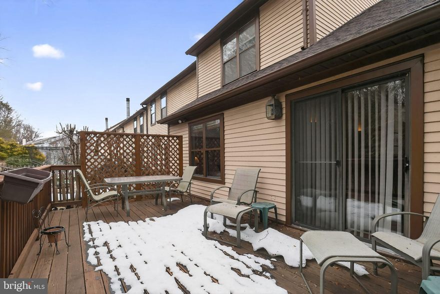 Charming end unit townhouse located in the coveted Stotesbury community. Offering over 2,052 square feet of living space, this meticulously maintained residence boasts four spacious bedrooms and 2.5 bathrooms, a main level family room, and a private rear deck. Step inside to find a beautifully designed eat-in kitchen seamlessly flowing into a warm and inviting dining and living area featuring a cozy gas fireplace, a vaulted ceiling, and sliding glass doors to the rear deck. There are hardwood floorings in the living room/dining room.. Outside, this end unit property offers a landscaped side yard in addition to the  expansive open common area that provides a serene backdrop for outdoor gatherings or quiet reflection. With an attached garage and additional driveway parking, convenience is at your fingertips. Enjoy the benefits of a well-managed community with maintenance of common areas. This exceptional property is not just a home; it's a gateway to an exclusive lifestyle where style meets comfort. Don't miss your chance to experience the best living in Stotesbury.