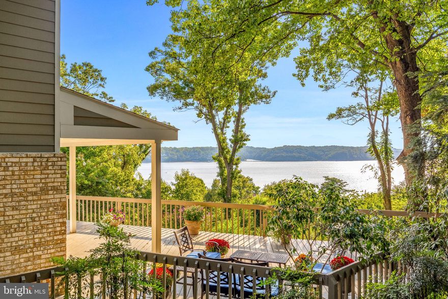 Enjoy a custom built, contemporary home perfectly situated in the heart of highly coveted Rugby Hall Estates with sweeping, expansive water views of the Severn River, This home offers peace and tranquility on a 1+ acre private lot nestled among magnolias, boxwood, nandina and crepe myrtle. With almost 5,000 sq ft of finished living space across 4 levels, there is space for everyone, offering 6 bedrooms with 4 full and 1 half bathrooms. Floor to ceiling windows maximize your view, coupled with glass door entry to the wrap around deck for seamless entertaining indoors and out. Enjoy summer nights on the side screened in porch with views of the lush grounds, gardens & the river. From the deck, the living room or the 3rd floor bedrooms, you can enjoy unparalleled sunsets over the river or have a front row seat to the Sherwood Forest fireworks and the weekly sailboat races.  Open concept main level has a gourmet kitchen offering stainless steel appliances, a large center island with seating and open to the dining area and living rooms beyond and provides plenty of space for entertaining. A wood burning brick fireplace brings cozy warmth  when the weather gets chilly. Custom main level mudroom offers wonderful built-in storage, laundry and a bonus freezer to make entertaining a breeze. The lower level is spacious with a living room, bedroom, full bathroom plus an apartment with separate private access ideal for in-laws or an au pair. The apartment includes a kitchenette, living area, separate bedroom and private bath with windows that look out over the river.  As an added bonus- this level is fully handicapped accessible, complete with a 4 stop elevator to the 3 main floors and direct access to the driveway! The 3rd floor bedroom level offers a primary retreat maximizing views of the river including an upper level private deck. Ample space with dual walk in closets and a private bathroom with tiled shower, soaking tub and dual sink vanity.  Three additional bedrooms and a large hall bathroom complete this level. The upper 4th floor level includes a spacious room for an office, playroom or 7th bedroom and an additional storage room. There is no shortage of space. Enjoy the water privileged lifestyle along the Severn River with many amenities at the Rugby Hall marina just a short walk away- deep water pier, boat slips, ramp, pavilion, playground, volleyball and much more. Severna Park Schools!