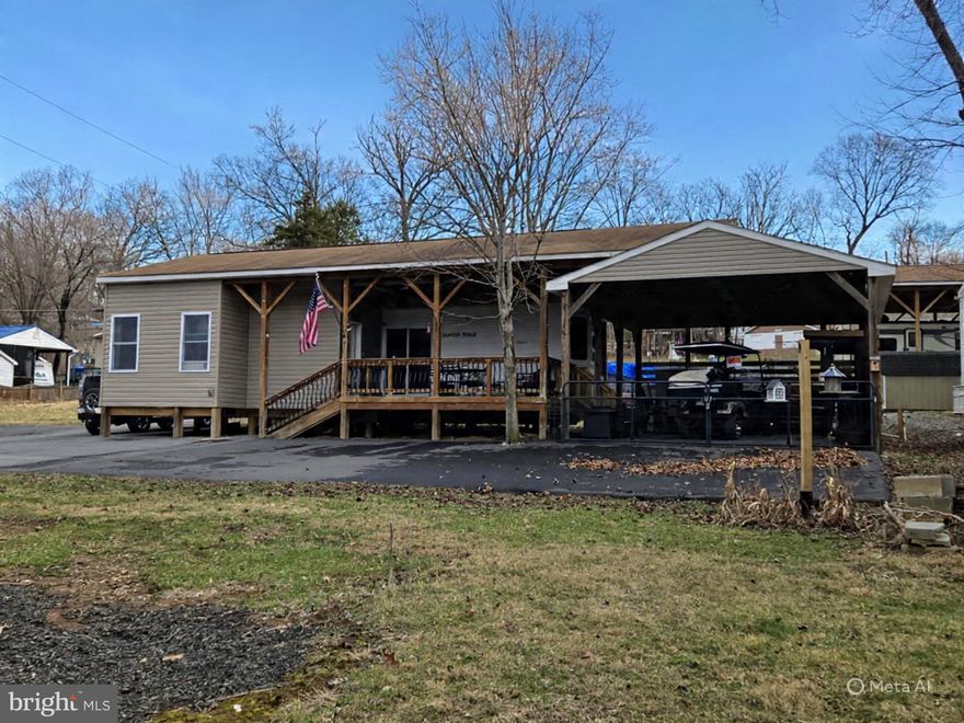 These side-by-side lots are being sold together and are ready for you to move in. Bring your camper to the empty lot that has electric and water,  or stay in the other lot featuring a 2011 Heartland Country Ridge Park Model, and start living the river life. Lot 9 has is asphalted with plenty of parking.   Enjoy a beautiful deck with a covered pavilion, plus a full outdoor kitchen and hangout area under another pavilion. The property also includes a private suite that fits a king-size bed and its own bathroom. The lot is fully fenced, perfect for kids or pets, and is close to the boat ramp for easy access. 
This gated community requires entry through the guard shack with proper ID for a visitor pass. Open seasonally from April 1 to November 1, River Bend is a privately-owned 400-acre RV resort on the Upper Potomac River in West Virginia, offering seasonal activities for members, families, and guests. Just a short drive from the Washington and Baltimore metro areas, it features utilities during the open season but grants lot owners year-round access. Members enjoy scenic views, wildlife, river access, trails, pools, mini-golf, sports courts, a youth center, laundry facilities, convenience store, lounge, bathhouses, boat ramp, bar and grill, and even a church. Seasonal events include fireworks, carnivals, bonfires, poker runs, tournaments, car shows, Halloween festivities, and more. Come see this fantastic lot and make it your getaway spot!