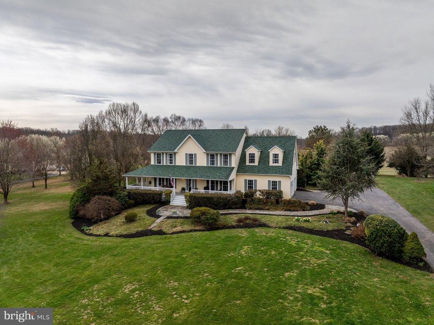 Beautiful farmhouse-style home set on 2.41 private acres with picturesque views and no HOA. A welcoming front porch offers the perfect place to relax and enjoy the peaceful surroundings, while the expansive backyard and deck provide ideal space for outdoor living and entertaining.

The interior features a move-in ready, thoughtfully designed floor plan with a dedicated main level office, ideal for today’s lifestyle. The kitchen opens seamlessly to the Family Room and a spacious eat-in area, creating a comfortable and functional gathering space. The kitchen includes a pantry, abundant counter space, and generous storage. Just off the kitchen, the mudroom offers exceptional convenience with a laundry center, powder room, garage access (2 car oversized), and built-ins for everyday organization.

The upper level includes four bedrooms and three  updated full bathrooms. The Primary Suite is a true retreat, offering additional space perfect for a sitting room, home office, or fitness area. It also features a custom walk-in closet with a storage system and a large en-suite bathroom complete with a soaking tub and walk-in shower.

The finished lower level provides incredible flexibility with a bonus room suitable for a bedroom, recreation space, or game room, along with a full bathroom and multiple storage areas. Walk-up stairs provide direct access to the backyard.

Additional highlights include a beautifully manicured lawn and a storage shed. This property offers space, comfort, and versatility in a serene setting, all without HOA restrictions.