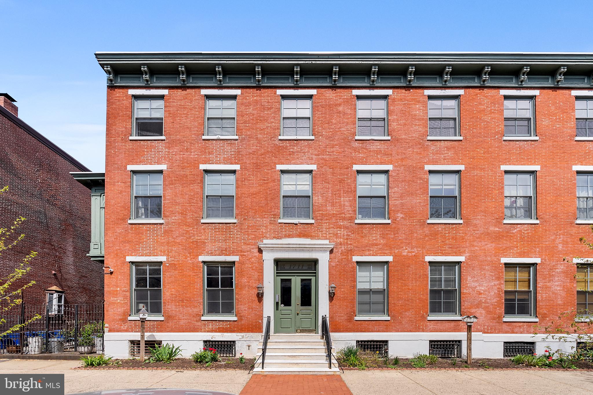 Don't miss this fantastic Fairmount area 1-bedroom condo in the Greencort condo building, tucked away in a quiet location. This condo offers wonderful amenities such as assigned parking, basement storage unit, in-unit full-size washer/dryer, Nest thermostat, plus it's conveniently located close to Whole Foods, Giant, SEPTA, public parks, Philadelphia Museum of Art and all of the restaurants, bars & shopping that this desirable area has to offer. Inside, you'll find hardwood flooring and a large living area with large windows and ample sunlight, plus a cozy wood-burning fireplace. The upgraded kitchen features newer stainless steel appliances and a pantry. The generously sized bedroom boasts a walk-in closet and an ensuite full bathroom complete with a sauna. Enjoy a beautiful shared courtyard & future rooftop deck. Greencort is a pet-friendly community. Schedule your showing today!