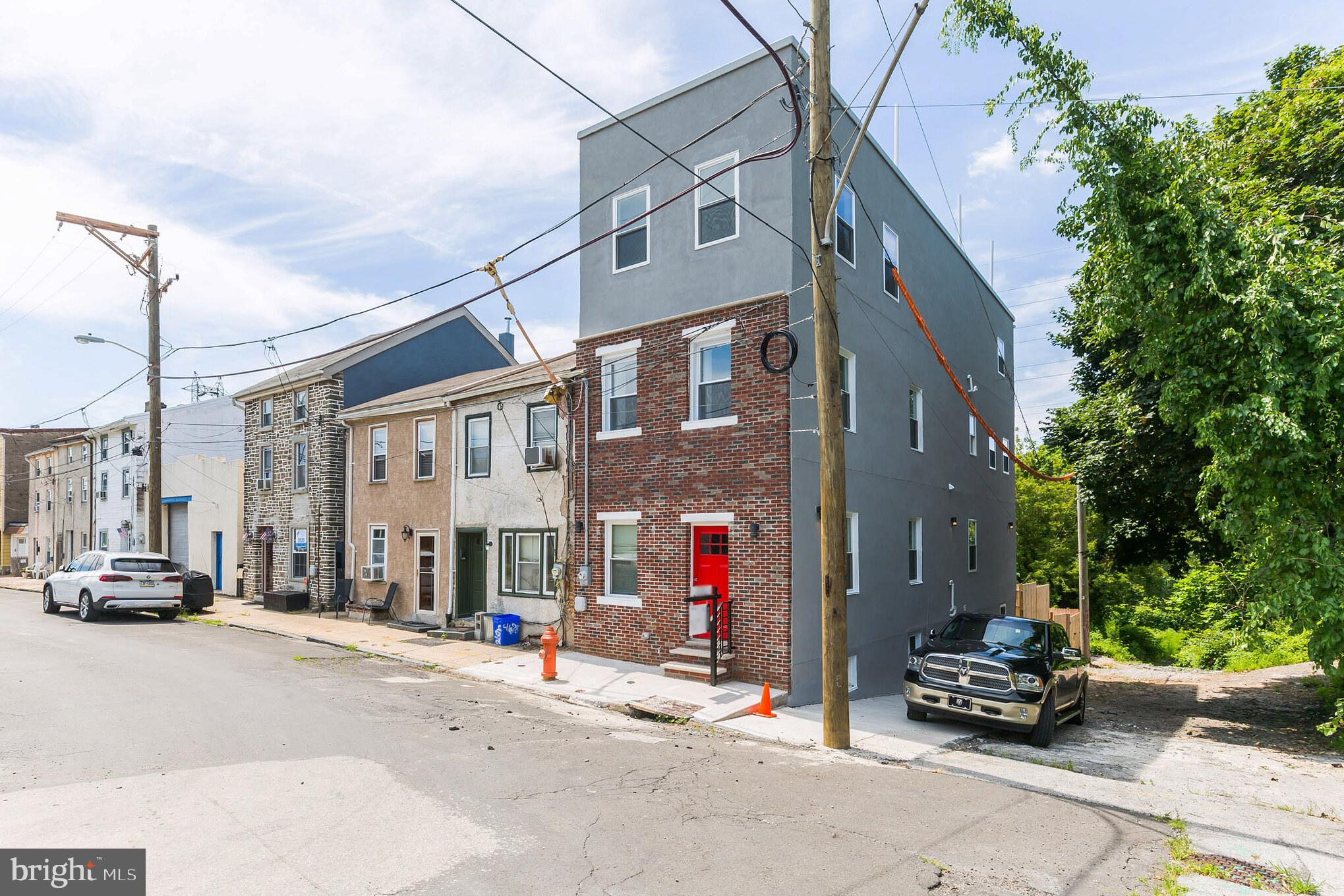 Nestled in the vibrant heart of Manayunk, this exquisitely renovated end-unit townhouse offers a rare blend of secluded tranquility and urban convenience. Situated on a peaceful street, this stunning residence is just one block away from Manayunk's lively Main Street, where an array of local bars, restaurants, and entertainment options await. Commuting is effortless with the Septa Train Stations located few minutes away.
Spanning over 3000 square feet, including the finished basement, this luxurious home boasts four spacious bedrooms and four and a half beautifully appointed bathrooms. Step inside to discover soaring high ceilings and elegant hardwood flooring that flows seamlessly throughout the entire residence. The first floor welcomes you with an expansive open layout encompassing a gracious living room, a formal dining room, a modern kitchen, and a convenient powder room. The natural flow between these spaces creates an inviting atmosphere perfect for both everyday living and entertaining.
The chef-inspired kitchen is a true masterpiece, featuring custom cabinetry, top-of-the-line stainless steel appliances, a center island, and sleek Quartz countertops. From the kitchen, step out onto a private patio that overlooks the backyard, providing an ideal setting for outdoor gatherings and relaxation. The second floor hosts two generously sized bedrooms, each offering ample closet space and accompanied by two full bathrooms and a dedicated laundry area for added convenience.
Ascend to the entire third floor, which is dedicated to the magnificent primary bedroom suite. This private sanctuary includes an oversized primary bedroom, a luxurious master bathroom, two substantial walk-in closets, and a convenient wet bar. Beyond the master suite, discover the breathtaking roof deck, where you can indulge in magnificent panoramic views of the picturesque Manayunk Hills.
The finished walk-out basement offers even more versatile living space, complete with an additional bedroom, a full bathroom, and a comfortable living room. This lower level presents an excellent opportunity for an in-law suite or guest accommodations. Adding to the allure, this smart home is equipped with controlled lighting, and smart thermostats for enhanced comfort and security. Parking is a breeze with a convenient pad located at the rear of the property for off-street parking, along with abundant free street parking available directly in front of the house for your guests.
An exceptional financial benefit awaits the fortunate new owner with approximately five years remaining on a full 10-year tax abatement.
Don't miss this incredible opportunity to own a piece of luxury in one of Philadelphia's most sought-after neighborhoods.
The owner is a Licensed PA Real Estate Agent.