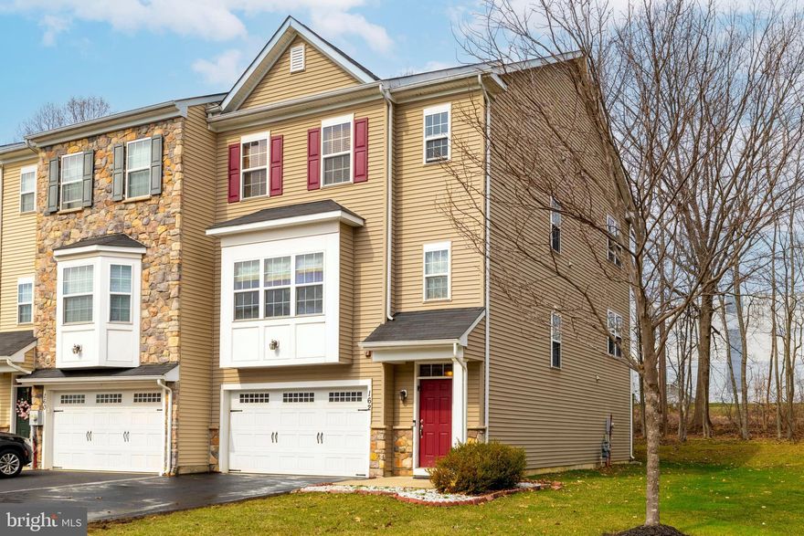 Opportunity knocks as this original Somerton Valley Townhouse owner is retiring to NJ! This beautifully maintained, bright & sunny 12-year old End Unit has so much more than meets the eye! The design of these Ryland homes provide spacious living embellished with today’s most desirable amenities. This particular home was built with an extension to all three floors, making this the largest of the Somerton Valley homes. This house also benefits from over $80,000 of 2013-ordered upgrades, many of which are not readily discernible. Classic hardwood floors make the initial impression when entering the foyer. The first of two staircases is on the right, while ahead lies the nearly 400 sq ft Family Room, convenient Powder Room and sliders to the backyard patio. Ample storage is found here - in the double coat closet, behind the staircases and inside the oversized garage. Peaceful quiet abides on the paver patio (10 x 8) beyond the sliding glass doors and into the woods beyond. The main living level above is an open-concept area. 9-foot ceilings enhance the feeling from the clear-span visuals that the Living Room (650?! sq ft), Kitchen and Dining area comprise. Significant features here include a large front bay window, the gas-fired marble-surround fireplace, coat & pantry closets, a Powder Room and an array of lighting: recessed, undercounter, pendant and chandelier. Less noticeable are the added touches, like crown molding, 42-inch wall cabinets, satin nickel hardware, glass block backsplashes, farmhouse sink, Ogee edge Golden Persa granite counters, moisture-proof recessed bathroom lighting and comfortable efficient ceiling fans. Cooks enjoy the benefit from the abundance of storage, outlets, lighting and counterspace provided in this island Kitchen layout, where the cook and the company are always in open contact. Cookouts and relaxing in the backdrop of the green woods are viable most of the year on the low-maintenance, manufactured-wood deck (20 x 8), lit by newel-post solar tops with a gas line for direct grill hookup and electrified for added possibilities. Upstairs are three bedrooms, two bathrooms and a convenient hall laundry with cabinets. The impressive I-don’t-want-to-leave Primary Bedroom suite features a vaulted ceiling with ceiling fan, walk-in and double closets and a four-piece Bathroom with separate commode, soaking tub, Ubatuba granite topped double sink and ample lighting. The Bedrooms both have double closets and ceiling fans. All closets have lighting that operates automatically.    The just off the beaten path location is just minutes away from Linconia and Benjamin Rush State parks, shopping centers, dining and entertainment. Convenient access to major highways, SEPTA and Amtrak stations makes Center City Philadelphia just 30 minutes away. The many yet-to-be-discovered extras in this home offers an exceptionally easy, low-maintenance lifestyle. Don’t miss your chance to own this 3000+ sq ft move-in ready gem that this most convenient, charming community has to offer!