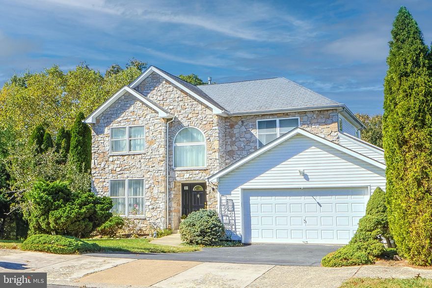 This beautifully maintained home, built in 2001, sits in a highly desirable neighborhood and has been meticulously upgraded for modern living. Thoughtfully designed with soaring 9-foot ceilings and expansive windows, it’s filled with natural light that creates a bright, inviting ambiance throughout.  

The open-concept layout features a gourmet kitchen with upgraded stainless steel appliances, a large pantry, and a peninsula breakfast bar that flows seamlessly into the family room and charming octagonal dining nook—perfect for everyday living and entertaining. A  formal living room and a convenient rear hall leading to the finished two-car garage add both elegance and functionality.  

Upstairs, the spacious primary suite offers cathedral ceilings, dual walk-in closets, and a luxurious bath with a soaking tub and separate shower. Three additional bedrooms and a full hall bath provide ample space for family or guests. The home also includes a finished walk-out basement with multiple closets, ceiling fans, and a dedicated utility room—ideal for recreation or additional living space.  

Enjoy the outdoors from the massive 12’ x 40’ rear deck overlooking a protected wooded area, or from the two lower patios that extend the home’s entertainment space. The premium .33-acre lot offers exceptional privacy, with generous spacing between neighboring homes and lush landscaping enhanced by added topsoil and a leaf-guarding gutter system.  

Additional highlights include:  
- Solid maple and oak flooring  
- Custom lighting and upgraded Schlage lever door handles  
- Eight ceiling fans 
- Oversized laundry room  
- New exterior A/C unit and 50-gallon gas water heater with circulator pump  
- Energy-efficient Tyvek house wrap and manually controlled HVAC dampers  

Nestled on a quiet, tree-lined street, this move-in-ready home offers the perfect blend of comfort, style, and convenience—just minutes from parks, shopping, and top-rated schools.

Please refer to the photo to see where backyard ends.