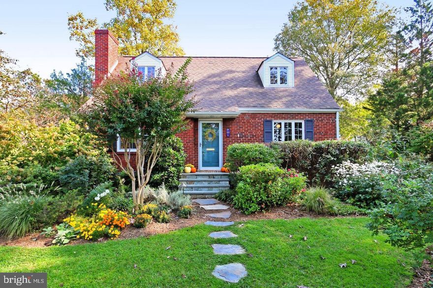 Exceptionally Charming Cape Cod in Arlington’s Barcroft Neighborhood! This delightful three-bedroom, two-bath home is nestled in a lush garden setting surrounded by mature landscaping in an absolute dream locale offering a serene atmosphere while being conveniently close to parks, shopping, dining, major commuter routes, and Washington, D.C.  Inside, the home boasts timeless charm and modern updates. The gleaming hardwood floors, a cozy wood-burning fireplace, and classic brick construction enhance its character. The reconfigured floor plan creates an open and airy feel while maintaining the home’s original appeal. The main level features a welcoming living room complete with oversized front window with views of the front gardens and an exposed staircase that adds to the home’s character. The expanded chef’s kitchen seamlessly adjoins the breakfast area. A full dining room (previously the 4th bedroom) is adjacent to this area as well, providing an ideal layout for both everyday living and entertaining. This level includes a main level bedroom and a remodeled full bath, adding convenience and flexibility. The upper level offers two spacious bedrooms, each featuring charming dormered windows and playful shed dormer rooflines. An updated full bath completes this level, offering modern fixtures and finishes while preserving the home’s classic charm. On the lower level you will find a partially finished rumpus room, making it the perfect space for gaming, TV watching, or simply relaxing. A large utility room provides ample storage space, a full-size washer and dryer, and a handy exterior entrance for added accessibility. The home also boasts a new hot water heater and a young HVAC system, ensuring comfort and efficiency.  Don't miss the Andersen replacement windows.  Outside, the lush landscaping and mature gardens create a peaceful retreat. The patio serves as the perfect space for outdoor dining and entertaining. The property also includes an off-street driveway for convenient parking.  Enjoy easy access to the W&OD Trail (just one block away) and Glencarlyn Park as well. This home is a rare find, combining timeless charm, modern functionality, and an unbeatable location.