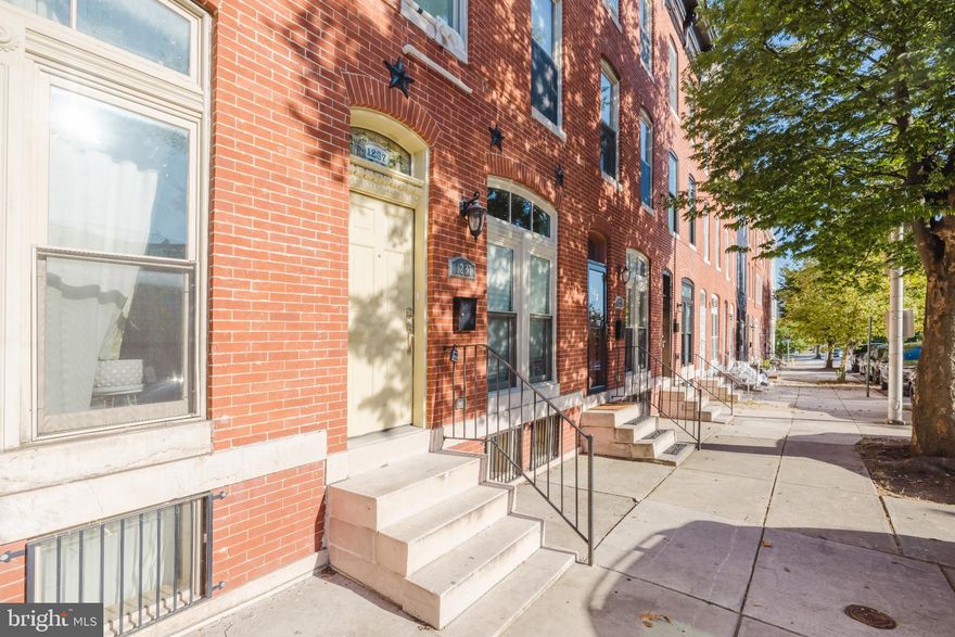 Nestled in the charming Johns Hopkins neighborhood, this exquisite Colonial townhouse begins with a marble stoop and tiled entryway, full renovated in 2012, offers a perfect blend of modern updates. With 3 spacious bedrooms and 2 full bathrooms, this home is designed for both comfort and style, making it an ideal retreat for a variety of lifestyles. Step inside to discover Baltimore's iconic curved walls, high ceilings and abundant natural light in this inviting interior, where gleaming hardwood floors flow seamlessly throughout the main living areas. The formal dining room sets the stage for memorable gatherings, while the eat-in kitchen is a culinary enthusiast's dream. Featuring high-end appliances, including a built-in microwave, 5 burner gas oven/range, and a sleek refrigerator, this kitchen is both functional and aesthetically pleasing. Recessed lighting illuminates the space, enhancing the beauty of the updated cabinetry and granite countertops. The home's thoughtful design includes a stunning curved staircase that adds a touch of grandeur, leading to the upper levels where tranquility awaits. Each bedroom provides ample space for relaxation and personalization. The bathrooms showcase modern fixtures and finishes that elevate everyday routines into luxurious experiences. The basement offers a versatile space with windows, perfect for your needs.  Outside, the property boasts a low-maintenance brick exterior.  The home is adjoined by park space behind, providing a sense of openness and connection to nature. The rear yard is a fully fenced private oasis, ideal for outdoor entertaining. Sidewalks throughout the neighborhood encourage leisurely strolls, while a nearby play area adds to the community's charm. Safety and efficiency are paramount, with energy-efficient double-pane windows and modern security features, including smoke and carbon monoxide detectors, ensuring peace of mind. The home is designed for sustainability, with a high-efficiency water heater and thoughtful construction materials that contribute to a lower environmental impact. One year free home warranty for peace of mind.  This exceptional property not only offers a luxurious living experience but also a vibrant community lifestyle, making it a perfect place to call home at a very affordable price.