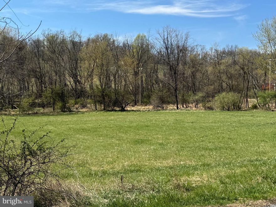 1.66 acre flat building lot in Middletown School District.  There is a small dwelling on property with kitchen, living room, 1.5 bathrooms, loft/bedroom ensuite with walk-in closet, washer and dryer, hot water heater, pressure tank, 2 mini splits (heat and AC).   Separate garage on property too. Call listing agent for further information regarding the dwelling, well and septic.