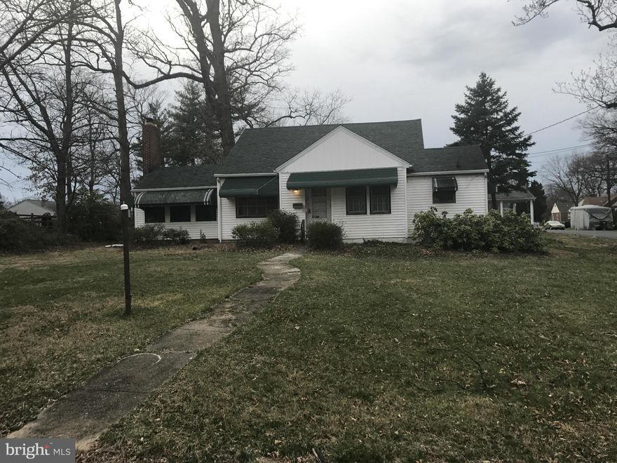 Built in the 1950's, this 4 bedroom, 3 bath home sits on a corner lot and features built-in bookcases, a basement and a finished attic. Ample parking with garage and carport. Perfect rehab project for someone!