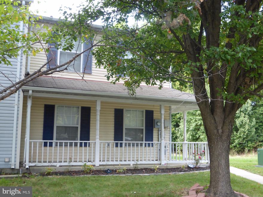 This end unit extends from a lovely wrap around porch to fenced backyard overlooking a huge open field.  There are 3 spacious freshly painted bedrooms.  Hardwood floors on first floor and new carpet on the upper level. First floor powder room and laundry room.  Off street parking. Near schools, restaurants, Walmart, Sam Club, and loads of shopping. Power washing and several repairs being done.