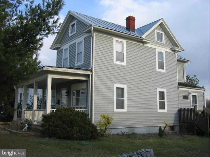 **REDUCED** PLUS $1000 ALLOWANCE** w/acceptable offer***3 bedrooms upstairs are nice sized.. Hardwood floors throughout most of home. Kitchen has laminated flooring, ceramic countertops. Separate diningroom & cozy livingroom. Walk to stores, post office. Eastside location, large level backyard 1/2 fenced, terrific rear deck. Covered front & side porches. Main level laundry & 1/2 bath.