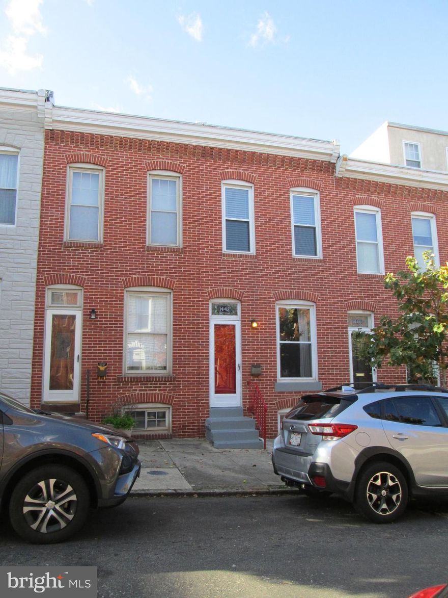 Charming Inner Harbor Row Home, Lots of Space & Light. Upper Level Large Master Bedroom, 2nd Bedroom and Full Bath. Main Level Living Room Dining Combination with Hardwood Floors and Powder Room. Cozy Eat in Kitchen with plenty of room.  Lower Level Fully Finished Basement, with space for Studio or Office. Freshly Painted, New Carpeting, Refinished Hardwood Floors, with Ceiling Fans throughout. Warm & Inviting Fenced in Courtyard Patio that has Potential for Parking Pad.This property is ready for move in, very clean. Walking Distance to Inner Harbor, Locust Point, Shopping Centers and more. View the Water of the Inner Harbor from the Front Steps. Easy Access to 95 & 295.