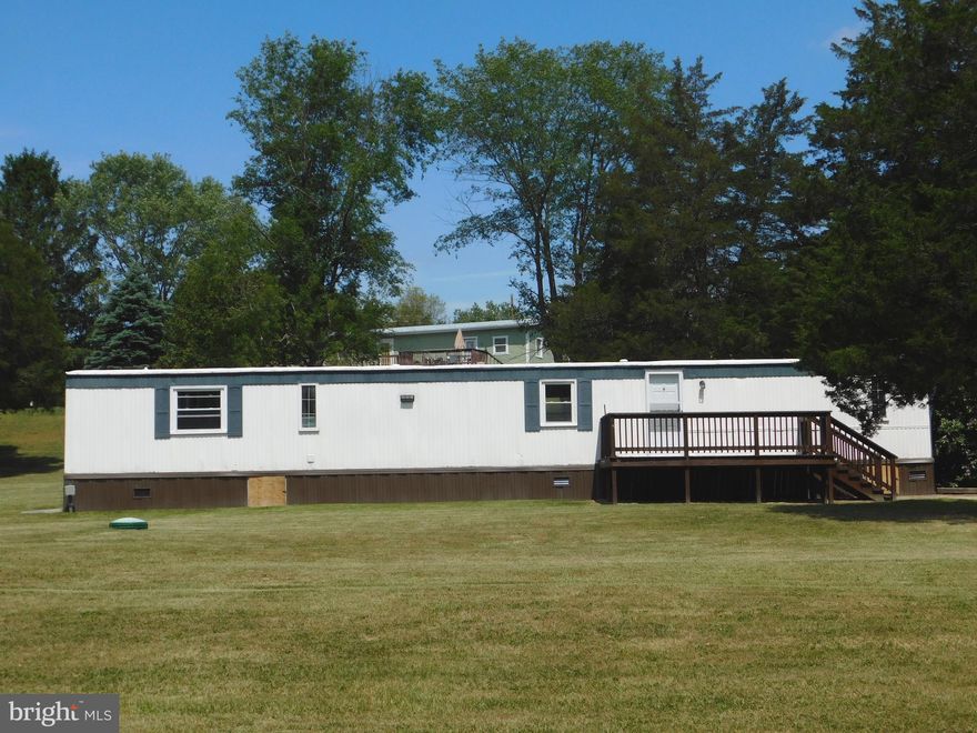 Location, location, location! Just 0.2 miles off Route 50, this well-maintained single-wide home offers comfort, updates, and convenience all in one package. Featuring 3 bedrooms and 2 full bathrooms, the split floor plan places the primary suite on the opposite end of the home for added privacy, complete with an ensuite bath.

Situated on a 0.83-acre mostly level lot, the property provides an ideal setting for outdoor enjoyment, entertaining, or simply relaxing in a peaceful setting. Recent updates include a refreshed kitchen with new cabinetry and appliances, new carpet throughout, upgraded insulation in the crawl space, and an HVAC system that is less than two years old.

Conveniently located approximately 30 miles from Winchester, VA, this home offers easy access to commuter routes while still providing a quiet, spacious feel.
