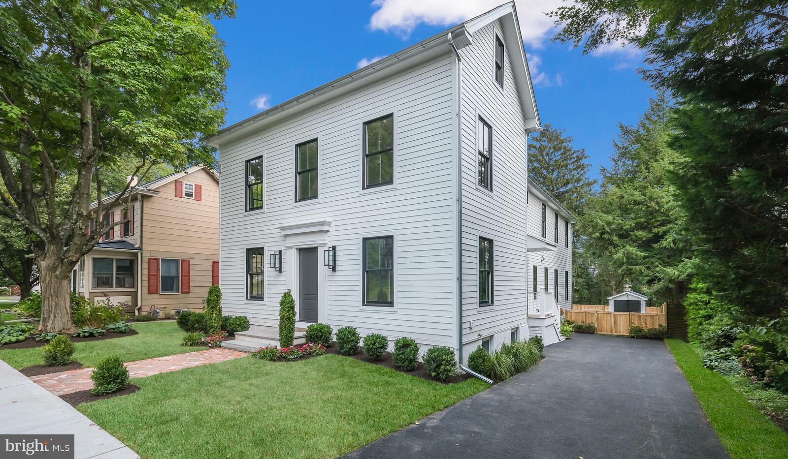 OPEN HOUSE, SATURDAY, NOVEMBER 13TH, 1 - 3 PM. Prepare to be thrilled when you visit this one-of-a-kind custom home in the highly sought after Borough of Doylestown. An impressive blending of attractive design and architecture have brought this complete renovation to its finished glory. The soothing color palette includes beautiful wide plank white oak flooring, black Anderson windows, accents of white shiplap, elegant light fixtures, and touches of gray tile laid in eye-catching patterns. Beginning with the front entrance and its herringbone brick walkway and gas lanterns, the passionate detail of this project are strongly conveyed. As the gathering space of this home, the kitchen includes all that you could wish for - white quartz countertops with subtle touches of gray and gold, picket dolomite marble backsplash, huge island with seating, stainless steel appliances featuring a 48” Monogram range with 6 gas burners, gas double oven and griddle, built-in drawer microwave, large refrigerator, and beverage refrigerator. Endless storage opportunities exist with the extensive cabinetry in the kitchen, including the wet bar area next to the dining space and the glorious walk-in pantry fully equipped with custom shelving. The kitchen and family room are open to each other and anchor the back of the home. Savor the privacy of the rear yard with views through the wall of glass sliding Anderson doors. The first floor dining room includes a custom wood design on the ceiling and french doors, setting the stage for many uses. Also on the first floor is an office with a wall of built-in shelves and french doors, leaving the opportunity for flexible use of this space. A dry bar offers additional storage space and can be a fabulous flex space. The side-entry mudroom is ready for action with the built-in bench, coat hooks, basket ready shelves, and a closet for all that can be tucked away. A gorgeous marble and gold vanity anchors the half bath on the first floor. And yet there is more.... the primary bedroom en-suite is AMAZING! The bathroom in this suite is spa-like and offers a completely custom wet room housing the beautiful soaking tub and large shower area, with a handsome black metal and glass door separating this space from the double sink vanity area and private water closet. Double walk-in closets add to the storage options in this special home. The large bedroom area has vaulted ceiling and a stunning treetop view of vistas in the distance. Two additional well sized bedrooms share an attractive hall bathroom. The second floor is host to the laundry room, complete with full size stackable washer and dryer, and generous cabinet and counter space. The third floor bedroom en-suite is fantastically private, setting the stage for many uses. Outside, the deck flows seamlessly from the family room, and connects to the herringbone brick patio and large grass space. The designer shed offers storage and has a TV alcove to elevate the patio area into an outdoor entertainment zone. The driveway can accommodate off street parking, and the basement was waterproofed and offers a great space for storage. So many important features are new: roof, hardiplank siding, windows, electric, plumbing, sewer/water line to street, cedar fence, mechanicals... and more. Walk to all of the fabulous attractions that Doylestown Borough has to offer. Yes indeed, you are home! Garage is possible, inquire with co-listing agent for more information.
