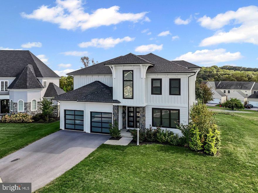 Stunning Home in Desirable Haydn Manor Community!  Better than new and no wait! Located on a cul-d-sac. This exquisite 4-bedroom, 4.5-bathroom two-story home offers over 4400 square feet of beautifully designed living space and an open floor plan perfect for entertaining. Step inside to impressive 10’ ceilings and a great room featuring a coffered ceiling and cozy fireplace.
The gourmet custom kitchen is a chef’s dream, complete with an 8-burner gas range, double ovens, quartz countertops,  subway tile backsplash, and  center island with breakfast bar. A private study/office with French doors and a shiplap accent wall adds charm and functionality.
The owner’s suite boasts a luxurious bathroom with an oversized walk in tiled shower, tile flooring, and a huge walk-in closet. Enjoy outdoor living on the large patio.  Backs to scenic open space.
The finished lower level offers a full bath plus a spacious finished area that would be great for a theatre room, excerise room.  Endless possibilities! Not to mention generous storage areas.  
Nestled within a 3-acre community park featuring a playground, pavilion, and walking trails, this home combines luxury and lifestyle. Conveniently located near major highways, Mad Chef Brewery, Son’s Ice Cream, Dunkin Donuts, and more.