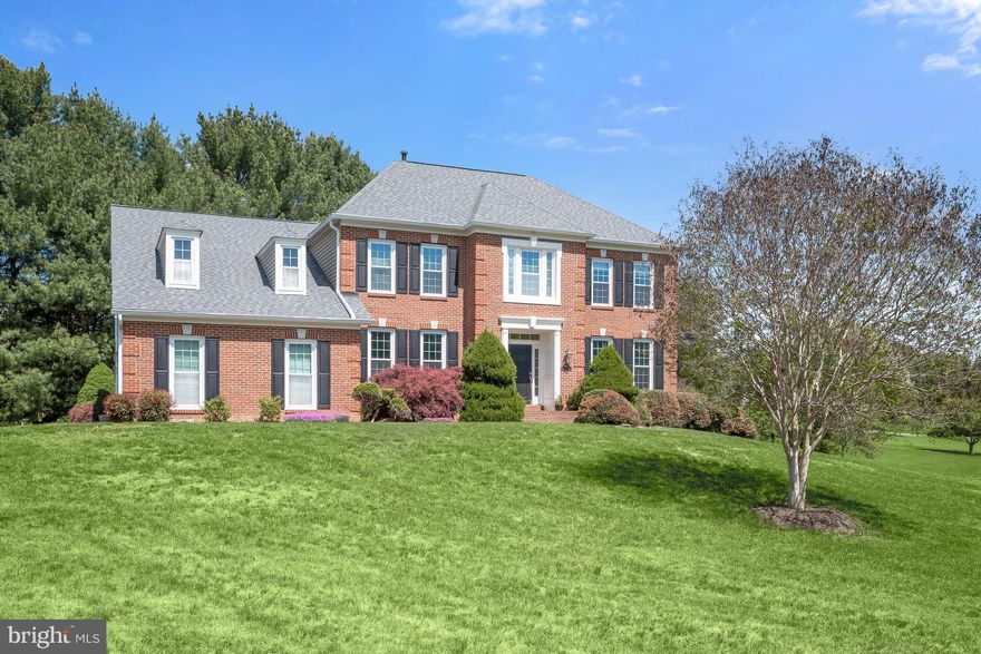 Elegantly sited on two acres of rolling lawn in the lovely Ashton Meadows neighborhood, 17422 Avenleigh Drive exudes welcoming tranquility. Built in 1994, this stately Colonial home offers 4 Bedrooms, 4 Full Baths, 1 Half Bath across 3 elegantly curated levels and 5,607 square feet of living space, including Main Level hardwood floors and triple crown molding, and an attached, side load 2-car garage.

The Foyer, flanked by the Living Room and Dining Room, welcomes guests into this sun-filled home. The Living Room includes windows on 2 exposures. The Dining Room showcases a modern chandelier, chair railing and wainscoting; design details that elevate the room and create a beautiful space to host family and friends. The Family Room, opening to the Sunroom, Foyer and Kitchen, is truly stunning, offering recessed lighting, cathedral ceilings with skylights, a stacked stone wood-burning fireplace with slate hearth, and a dramatic iron chandelier. The enchanting Sunroom includes recessed lighting and French doors to the Rear Deck. The Island Kitchen is the heart of the home, boasting white cabinetry, granite counters and tile backsplash, breakfast bar seating, a pantry closet, a coffee bar area, recessed lighting, pendant lights over the island and a Breakfast Area with an iron chandelier as well. The handsome Office includes a custom built-in bookcase, recessed lighting and crown molding. The Main Level’s offerings are complete with a Powder Room, a Mud Room, including tile flooring and garage access, and an accommodating Laundry Room, including a front load washer and dryer, a utility sink, cabinetry and a window.

Ascending the hardwood staircase to the Upper Level, the Primary Bedroom boasts a tray ceiling and modern light fixture, crown molding, a large walk-in closet and an ensuite Full Bath. The spa-like, Primary ensuite Bath includes tile flooring, dual vanity with granite counters, a jetted tub, a stall shower with tiled surround and frameless glass door, skylights, recessed lighting, and a separate water closet; enjoy well-deserved relaxation in this peaceful oasis. The Second Bedroom includes access to the Jack and Jill Full Bath, shared with the Third Bedroom that includes a lighted ceiling fan. The Fourth Bedroom offers an ensuite Full Bath, including tile flooring, a single vanity, and a stall shower with tiled surround. The Upper Level’s offerings are complete with the Upper Hall, including a linen closet. 

Descending the hardwood staircase to the Lower Level, the impressive Bar Room includes laminate flooring, a walk-behind wet bar, recessed lighting, glass shelves behind the bar and a bar refrigerator. The Recreation Room offers laminate flooring, recessed lighting, a wood-burning fireplace with brick surround and a wood mantle. The Exercise Area boasts laminate flooring, an exterior door to walk-up stairs, and access to under stair storage. The Guest Room includes carpeted flooring, recessed lighting and mirrored closets. The Bonus Room with laminate flooring could be transformed into a second Office, a Wine Room, Theater or Gym – you decide! A Full Bath with tile flooring, and a tub shower with tiled surround and a utility closet complete the Lower Level’s offerings.

Host gorgeous al fresco dining experiences and enjoy the refreshing spring air on the expansive Trex Deck, including a gazebo and steps that lead down to the grilling area. The property is complete with a generator, for convenience and comfort in any weather.

In close proximity to Northwest Branch Stream Valley Park, Woodlawn Park and Hampshire Greens Golf Course, plus convenient shopping and commuter routes, 17422 Avenleigh Drive offers the very best of residential living. Schedule a showing today!