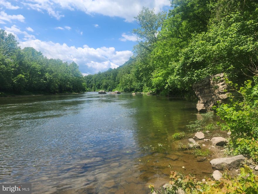 CALL IT A UNICORN, A FLYING PIG, OR JUST A RARE FIND.  WHATEVER YOU CALL IT,  YOU CAN REST ASSURED THAT YOU WON'T BE DISAPPOINTED IN THIS 10 ACRE  !!UNRESTRICTED!!  PARCEL WITHIN EARSHOT OF THE SOUTH BRANCH OF THE POTOMAC RIVER.  THIS UNIQUE LOCATION CAN BE FOUND AT THE BASE OF WHITEHORSE MOUNTAIN NESTLED BETWEEN 2 PUBLIC ACCESS POINTS TO THE RIVER.  THE SOUTH BRANCH IS WELL KNOWN FOR IT'S BEAUTIFUL FLOAT TRIPS BY TUBE OR KAYAK, TREMENDOUS  SMALL MOUTH BASS FISHING, AND WONDERFUL SWIMMING HOLES.  JUST IMAGINE OWNING YOUR OWN PROPERTY SMACK DAB IN THE MIDDLE OF IT ALL.  DUE TO THE DISTINCTIVE HORSESHOE BEND IN THE RIVER,  YOU CAN LAUNCH YOUR BOAT OR KAYAK AT ONE ACCESS, FLOAT FOR 3 HOURS, AND TAKE OUT A MILE FROM WHERE YOU PUT IN.  THIS PROPERTY EXISTS ALONG THE ROAD BETWEEN THOSE 2 ACCESS POINTS MAKING IT SUPER CONVENIENT FOR ANY AND ALL RIVER ADVENTURES.  THE PARCEL FRONTS ON A PAVED, STATE MAINTAINED, DEAD END ROAD AND COMES WITH A RECENTLY INSTALLED DRIVEWAY AND BUILD/CAMP SPOT.  FROM HERE YOU CAN HIKE UP TO THE ROCK CLIFFS AT THE TOP OF THE PROPERTY,  AD SOME ATV TRAILS, SHOOT, HUNT, OR JUST SIT AND TAKE IN THE PEACE AND QUIET. THE CHOICE IS ALL YOURS.  NOW IS THE TIME TO CARVE OUT YOUR OWN PRIVATE RECREATIONAL PARADISE IN THE MOUNTAINS OF "ALMOST HEAVEN".  PLAN A VISIT TODAY!