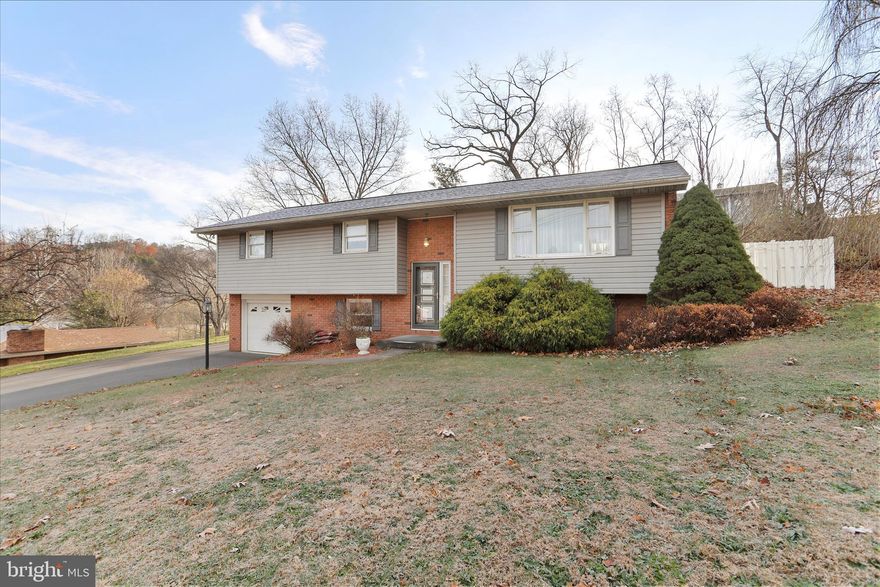 79 Leon Drive in Fort Ashby, WV is a practical and well-built residence offering over 2000 square feet of living space with a comfortable layout that includes three spacious bedrooms and two full bathrooms. Built in 1973, it features the solid character and durability of a brick exterior, complemented by a finished basement that adds valuable additional living or recreation space. A fireplace creates a cozy focal point inside, while the attached garage provides everyday convenient parking and storage. The property features a large in-ground pool complete with a fun, built-in slide, perfect for summer entertainment and family enjoyment. This property offers privacy, outdoor potential, and a peaceful setting within the small, close-knit community of Fort Ashby.  Its size and well-maintained structure give it strong long-term value for homeowners or investors seeking a comfortable residence in the beautiful mountains of West Virginia.