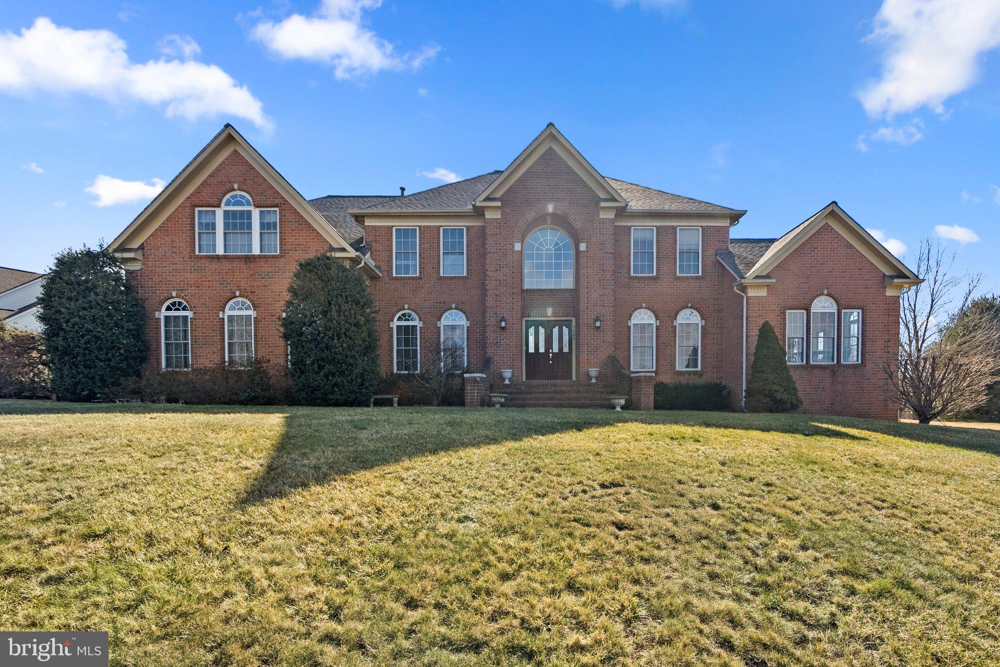 Welcome to 3608 Clear Drive Court, located in the highly desirable Cattail Ridge community. This beautifully maintained home boasts exceptional curb appeal and a picturesque setting. Upon entering, you’re greeted by a bright foyer with soaring vaulted ceilings, leading into the heart of the home or the charming sunroom. The main level features hardwood and marble floors, recessed lighting, and an open-concept kitchen with a center island, dining area, and a convenient galley with a built-in desk.
The cozy family room, just off the kitchen, offers a fireplace and two-story ceilings that flood the space with natural light. Adjacent to the family room, you'll find a private office space and ample storage with built-in hallway closets. The deck, accessible from both the kitchen and family room, overlooks the expansive backyard—perfect for outdoor activities. A beautifully landscaped pathway leads from the driveway to the front porch. This home also includes six spacious bedrooms, including a luxurious primary suite with a spa-like bath and soaking tub. The finished basement provides additional living space, including a recreation room, extra bedroom, bathroom, and abundant storage. With its generous square footage and flexible layout, the possibilities in this home are endless.