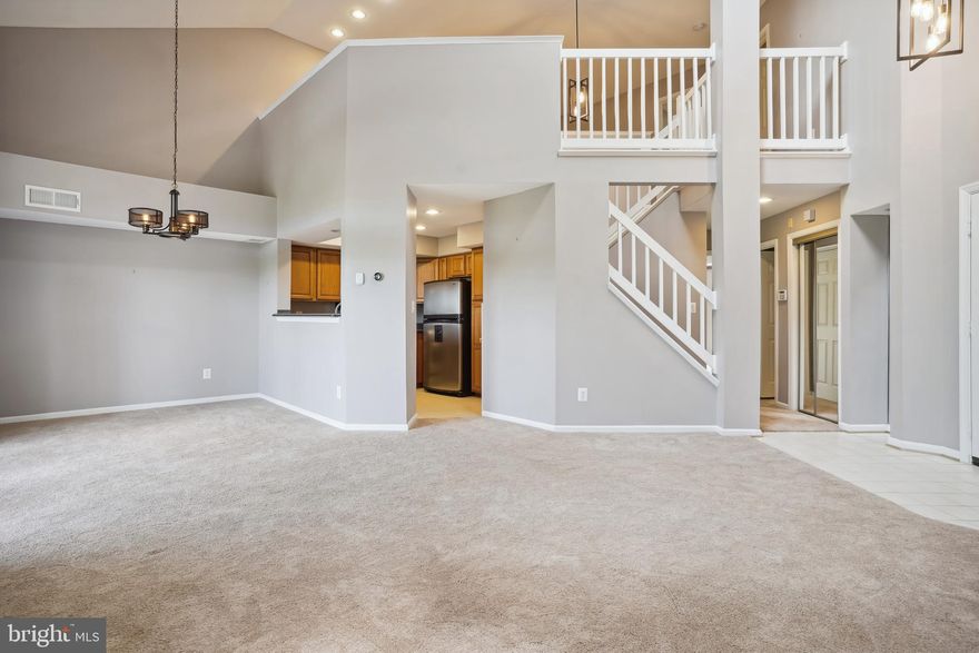 Welcome home to  2-Level Condo living, less than  3 miles from the Silver Line Metro at Wiehle Ave 
A 2-story Livingroom with a gas fireplace greets you, as you enter the 1540 SQ Ft unit.  The kitchen features Corian counters and Stainless Steel appliances.  The main level has a Huge Primary Suite that features a 2 door walk-in closet and a bathroom with an oversized dual vanity.   The stacked washer & dryer, 1/2 bath, and exit to the huge patio are also on the main level.  The upper level boasts a loft space and  2nd bedroom with a vaulted ceiling and a separate full bath.  

Less than a mile from North Point Village Center & Giant, 2.4 miles from Reston Town Center, and less than 3 miles from Whole Foods.

The unit comes with 1 reserved parking space