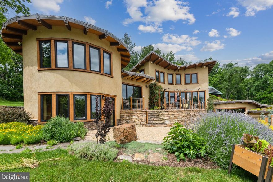 SIGNIFICANT PRICE IMPROVEMENT. COME SEE IT THIS WEEKEND. Welcome to Beausoleil, the house that is a true work of art and showcases sustainable living at its best. West of Frederick Maryland, the house is just fifty miles from Washington, DC. Built on a 19-acre lot that's surrounded by trees, the 4-bedroom, 3.5 bathroom house was custom designed by Sigi Koko, one of the nation's leading natural building architects. The house is built almost entirely of natural materials, including lumber from the property, natural clay plaster inside, lime plaster outside, and strawbale wall insulation. The living roof keeps out the heat of the summer sun. Tapping into geo-thermal and solar sources, the house is energy self-sufficient and has its own micro-grid. The oversized detached five-car garage has a 1000 SQFT finished studio above it that's perfect for yoga, meditation, painting, music, and other creative activities. The property also features a stable and run-in shelter for horses and a large shed/garage for farm machinery and equipment. Enjoy supreme privacy and exquisite mountain views at Beausoleil, the most unique, beautiful, and natural home East of the Mississippi. Contact the listing agent for a private tour.