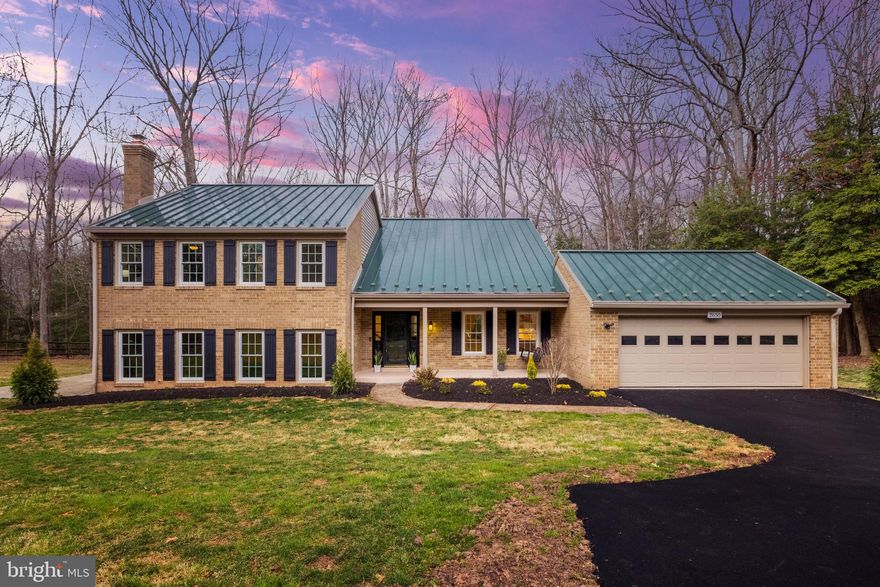 Open House Sunday April 6th 2-4pm**This woodland sanctuary at the end of a private drive represents Fox Mill Woods living at its finest. Set on nearly an acre of mature tree privacy, the highly upgraded home offers an escape from the everyday while keeping you connected to everything that matters. Enjoy Reston amenities with no HOA! Arrive to an oversized 2-car garage, wired for EV charging, and a covered entryway. Inside, an open layout unfolds from the spacious foyer to a light-filled living room with treetop views. Designer touches, including select new lighting and fresh paint throughout, highlight your formal living and dining areas, which open directly to private outdoor living on a screened back porch complete with skylights, ceiling fan, and an open deck with a hot tub. The kitchen features high-end Shaker cabinets and stainless steel appliances, including a newer refrigerator and a brand new dishwasher in 2025, adjoined by an eat-in dining area that is perfect for casual meals and conversation. On the home's southern side, an expansive family room with a wood-burning fireplace and feature wall creates an intimate space for relaxing and entertaining. A full bath nearby is beautifully updated in contemporary hex tile and Shaker vanity. Down the hall, a huge bedroom/den with its own exterior access adds even more versatility and storage. Upstairs, retreat to your palatial primary suite. The primary bedroom features a private sitting room, which easily doubles as an office, and double closets spanning an entire wall with Elfa closet organizers. A laundry nook is conveniently located in the primary bath, leading into the bathing area with heated floors, granite double vanities, and an oversized walk-in shower with double heads. Three more bedrooms on this level are generously sized with good natural light, served by a chic updated bathroom with classic subway-tile surround. Outside, the property continues to impress with its combination of amenities and natural beauty. Gather at the fire pit, explore the tree house, or simply enjoy the serenity of your wooded surroundings. Recent updates include a durable metal roof, efficient geothermal HVAC system (2018), updated screened porch (2023), and refreshed bathrooms (2021). Additional upgrades include commercial-grade eco-friendly laminate flooring, tankless water heaters, whole-house humidifier, attic fan, and a spare parking pad, with separate electrical panels for the pad, garage, and primary bath. Located adjacent to 200 acres of wooded parkland yet just minutes from local shops, restaurants, Reston Town Center, and Dulles International Airport, this home offers a unique blend of privacy and convenience. An easy access nature pathway from the backyard leads directly to Crossfield Elementary School. Enjoy the prime Reston location, positioned just outside of Reston's HOA boundary, giving you freedom from HOA fees and restrictions while maintaining close access to all area amenities. The Fox Mill Woods private swim and tennis club is moments away, with no waiting list to join. Walk, hike, and bike the great outdoors in Reston's 55+ miles of trails and 1,350 acres of open space just minutes away. The area also boasts world-class shopping and dining, exceptional recreation, highly-rated schools, and outstanding healthcare options, and commuters enjoy easy access to the Wiehle Metro Station, Reston Station, and all major commuter routes. At this special property, the seasons unfold through your windows while the world's conveniences remain just minutes away. A place where you can truly disconnect without sacrificing connection.