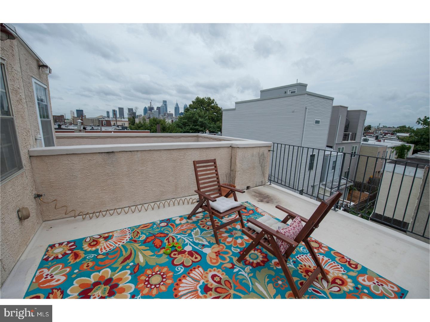 Check out the view from the 10 X 15 roof Deck. This Point breeze town home, built 10 years currently an investment property is a wonderful investment or owner occupant. The tenant will be leaving by second week in June. First floor has a comfortable living room with a dining area and powder room, a large kitchen with stainless appliances, an eating area and rear exit to a great garden patio. On the second floor there are two large bedrooms and a hall bath with whirlpool tub up the steps there is access to a fabulous roof deck with great city views. But wait there's more. 22nd street. has a 12 x 15 finished room in the basement with an additional laundry room.
