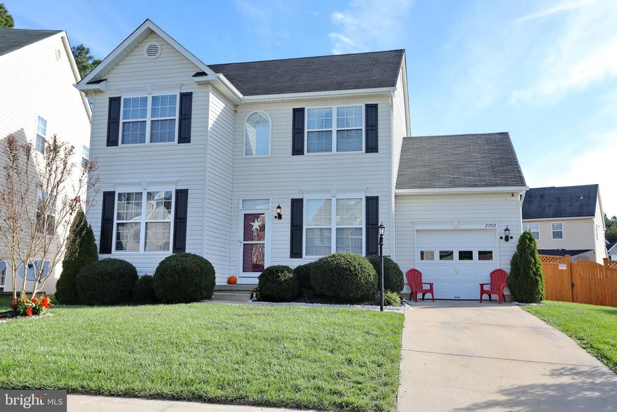 FALL in love with this Gorgeous Colonial, Meticulous owners have maintained home well. Beautiful laminate flooring through out main level, high end Chef stainless appliances, white cabinetry, eat in kitchen, living room and office area with private door. Deck off kitchen area overlooks beautiful lawn, fenced in back yard great for family cook outs. Upper level features 3 bedrooms, 2 full bath, master is spacious w/ walk in closet. What's not to love in this finished basement, the perfect #10 Man Cave. Enough space to entertain in the den area with bar/sink/fridge, game room area and separate room owner using as gym could easily be 4th bedroom. Enjoy the Community pool and clubhouse. Corner lot home in a great neighborhood, just minutes to Patuxent Naval Base & many favorite restaurants and shopping centers