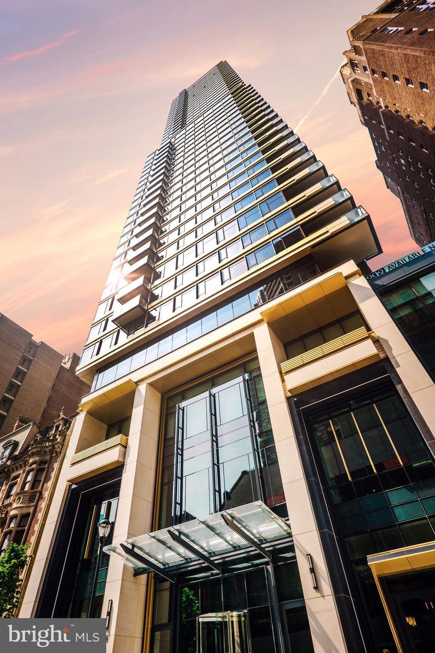 Introducing The Laurel, Philadelphia's newest luxury Condominium and the final residential opportunity on historic Rittenhouse Square. The striking glass tower soaring 48 stories is a masterpiece of contemporary architecture designed to inspire. The Laurel offers quarter floor Sky residences, half floor Estates and full-floor customizable Penthouses.  Come home to one of the most spectacular sunsets the city can offer through the floor to ceiling windows.  The corner balcony allows for a dynamic experience of views from north, west and south giving this home optimal light exposure.  The Euro-style kitchen showcases a stunning high gloss Polar White and American Walnut cabinetry combination.  Your chef will enjoy this state-of-the-art Sub-Zero and Wolf with an integrated refrigerator, gas cooktop, steam oven and full size convection oven. The kitchen island features Calcatta Quartz counters with waterfall edge, a large undermounted sink, Dornbracht faucet, Signature dishwasher and under-counter drawer microwave.  Gorgeous 8” wide plank blonde oak hardwood from Carlisle can be found throughout this home including the bedrooms.  Homeowners will enjoy a spacious owner’s suite with two large walk-in closets, stunning sunset views and your own private spa-like oasis with luxurious freestanding soaking tub atop Empyrean Ice White marble floors surrounded by floor to ceiling porcelain walls and complimented by an expansive shower with Fantini shower fixtures.  A comfortable size laundry room with full size Maytag washer and vented dryer make life easier.  Prewiring for future blinds and smart home technology complete this magnificent residence.
***One parking space is included in listed price, second parking space is available for additional $100,000***