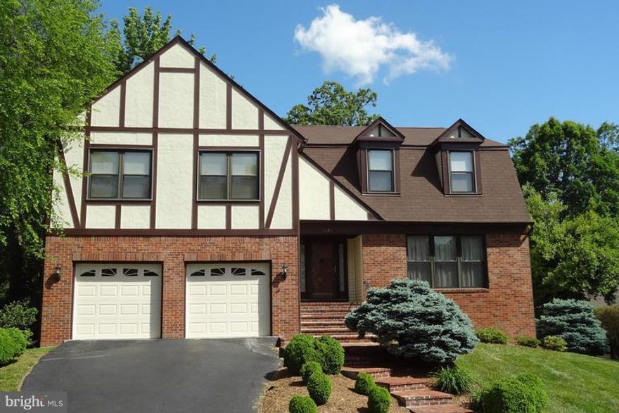 Beautiful 4BR/2.5BA home w/2 car garage. Almost 3,300 SF on top 2 levels! Charming exterior full of brick accents & neat trimmed landscaping! Spacious open main lvl w/wide plank maple HW floor, new KIT appliances, new granite, desirable Butler's Pantry! Sun Deck & treed back yard. 1,000 sqft MBR suite w/sitting room, private den, 12x12 walk-in closet & Huge MBA. Unfin LL w/rough-in. Great location