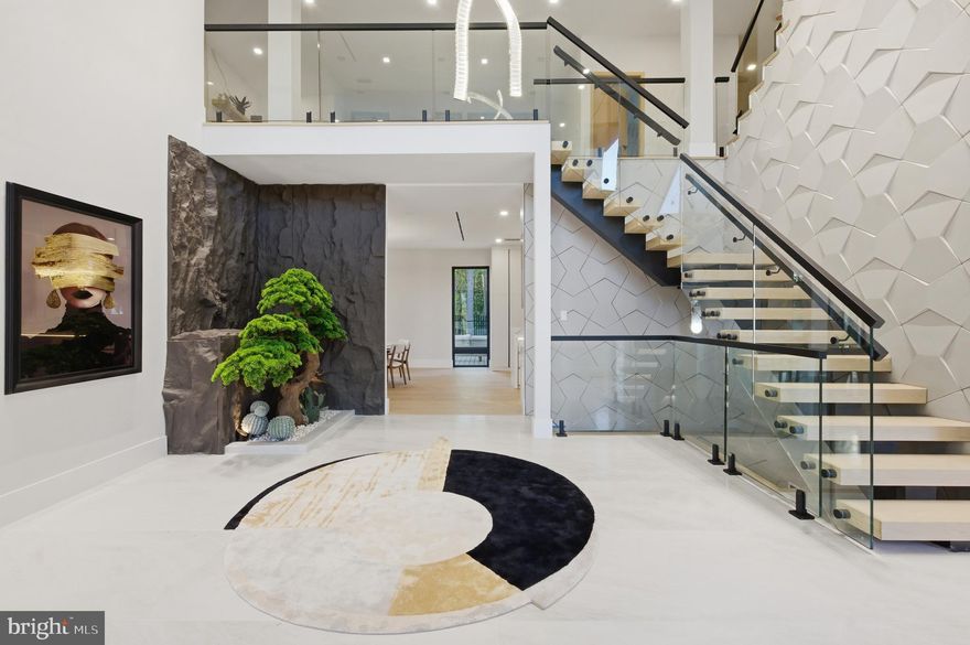 A rare offering in the heart of McLean, this like-new construction modern estate spans over 11,500 square feet across four meticulously designed levels, delivering a level of scale, privacy, and sophistication seldom available in the Washington metropolitan area.

Conceived for both formal entertaining and everyday luxury, the residence features eight bedrooms, nine full baths, and two half baths, including a main-level guest suite and a seamless integration of grand entertaining spaces with more intimate living areas.

At its center, a chef’s kitchen with adjoining scullery is designed to accommodate elevated hosting, supported by expansive living and dining environments framed by natural light and clean architectural lines. A three-stop elevator provides effortless access throughout.

The outdoor experience rivals that of a private resort—anchored by a pool, multiple decks, and a covered pavilion with grilling area, offering a refined setting for gatherings or quiet retreat.

The lower level is dedicated to wellness and leisure, featuring a fully equipped gym, sauna, and additional recreation spaces, creating a true in-residence retreat.

Positioned minutes from Langley and the CIA headquarters, and within a security-monitored enclave, the property offers a unique combination of discretion, accessibility, and prestige.