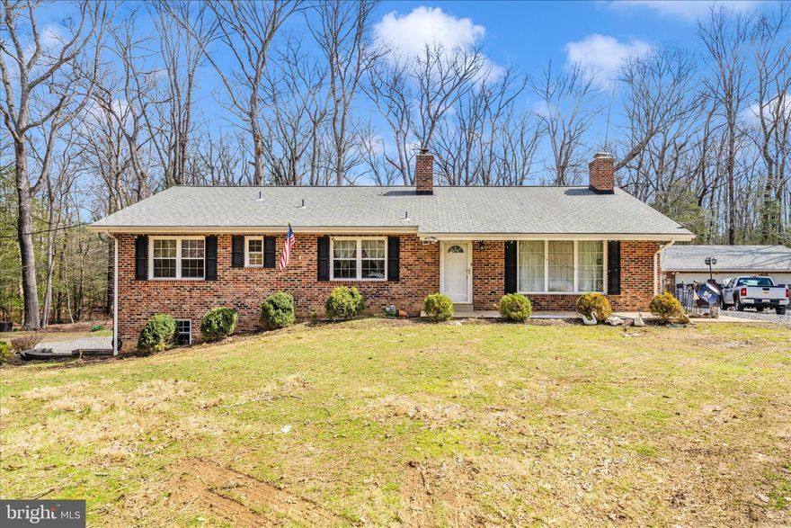 Discover a rare opportunity to own just over 24 acres of private, wooded paradise—a retreat where nature, comfort, and convenience come together seamlessly. Tucked away from the world yet minutes from major routes, shopping, and dining, this property offers the perfect balance of seclusion and accessibility.

A short 5‑minute walk leads you to your own lake, an incredible amenity for fishing, quiet mornings, or peaceful sunset views. With no neighbors in sight, the setting delivers unmatched privacy and tranquility.

Inside, the home offers 4 bedrooms plus a flexible bonus room that can serve as a home office, gym, studio, or guest suite. The updated primary bedroom and freshly refinished hardwood floors bring warmth and a refreshed, modern feel throughout the main level.

The lower level is designed for versatility, featuring a fully updated bathroom, private living area, and separate walkout—perfect for guests, multigenerational living, or potential rental income. The well‑maintained kitchen appliances and newly updated backyard patio make everyday living and entertaining effortless.

With ample parking for multiple vehicles, open land for farm animals, gardening, or outdoor recreation, and endless room to expand, this property adapts to your lifestyle and future vision.

A true private estate with limitless potential, offering the peace you crave and the convenience you need.