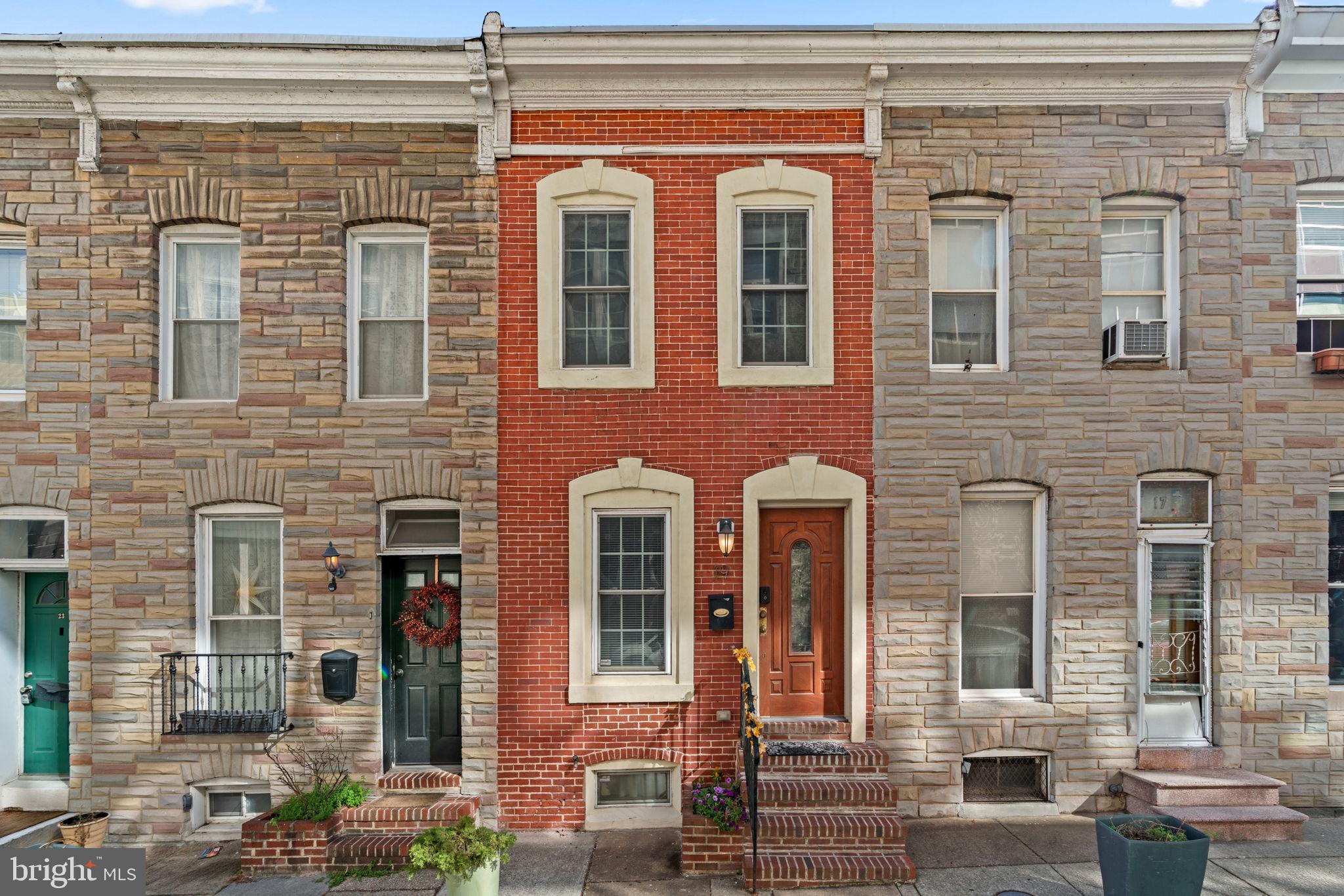 Beautifully updated and full of charm, this well-maintained 2-bedroom townhome offers the perfect blend of classic character and modern comfort! Gorgeous hardwood floors flow throughout the main and upper levels, complemented by a striking exposed brick wall that continues upstairs for a touch of historic appeal.
The bright, stylish kitchen features a detailed tile backsplash, granite countertops, center island, and stainless steel appliances—including a microwave range hood—and a unique wall mural that adds artistic flair. A convenient half bath is also located on the main level, and the kitchen provides easy access to the deck for outdoor enjoyment.
Upstairs, you'll find two comfortable bedrooms and a beautifully updated full bath with a separate soaking tub and shower. A skylight fills the upper hallway with natural light, enhancing the home's open and airy feel.
The finished lower level offers flexible space for a second family room, home office, or guest area, plus abundant closet space, a laundry nook, and walkout access to the privacy-fenced backyard and patio—perfect for relaxing or entertaining.
Recent updates include a new roof (2023), new A/C unit (2023), and a full renovation throughout, ensuring peace of mind and modern comfort. Enjoy easy on-street parking and unbeatable proximity to Patterson Park (just a half-block away), Canton, Fells Point, Little Italy, and the Inner Harbor, as well as Johns Hopkins, Bayview Medical Center, and Mercy Hospital.
Experience city living at its best—just steps from entertainment, nightlife, and award-winning restaurants! Mortgage savings may be available for buyers of this listing.