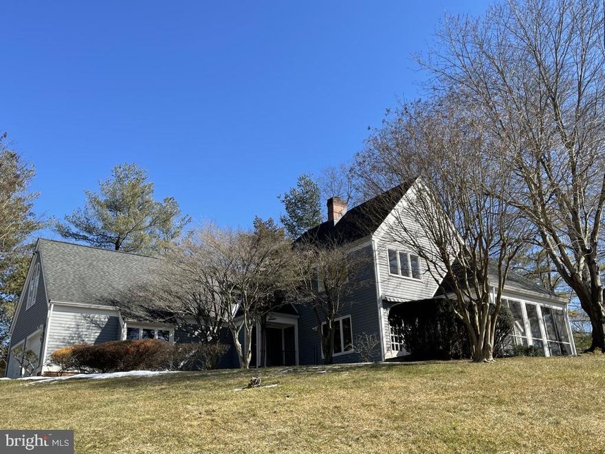 Wonderful opportunity to own a spacious home perched on a corner lot in desirable Ruxton Hill just in time for Spring! 1 Rockland View Court features over 4,500 square feet of above grade living space with the perfect combination of bright, light-filled living spaces and interesting architectural features throughout. The wonderful open floor plan - as well as fresh paint and new carpeting - create a clean, neutral palette to make your very own.  The main level living areas flow seamlessly into one another and offer an incredible open plan, high ceilings, beautiful hardwoods, large windows and French doors that lead from the living room onto a lovely screened porch. A gas fireplace, built-ins, and wet bar round out the living room which flows harmoniously into the dining room. The kitchen is fully open into the family room which has a second gas fireplace and a wonderful adjacent brick patio perfect for entertaining.   You will also appreciate the main level den or optional bedroom with an adjacent full bath, perfect as a flexible office/den/guest room space.   A main level laundry room, incredible storage including a very large cedar closet/attic, and an attached 2-car garage add to the many conveniences. The second level has an expansive primary bedroom with a large ensuite bath. Three additional bedrooms have a variety of attributes to include: built-in bookcases, interesting and versatile loft areas, and  two additional full baths, one ensuite.   A spacious and fully waterproofed and painted basement is ready to be made your own and could be easily transformed into a large recreation room and/or play/craft room.  Bring your decorator touches and make 1 Rockland Vue Court your very own.