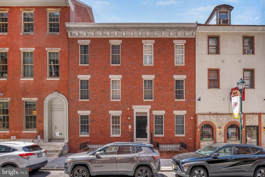 Located just off the Benjamin Franklin Parkway in Philly's vibrant Logan Square neighborhood, 1522-24 Race St #1 is a modern bi-level condo offering 2 bedrooms, 2 bathrooms, in-unit laundry, central a/c, and outdoor space. The exterior of this boutique condo building features a classic brick facade befitting the historic area. Stepping into the unit, you'll find a welcoming foyer with space for a bench. A coat closet as well as a laundry closet are nearby. Hardwood floors extend to the bright and spacious primary suite at the front of this level. It features a bedroom with a custom double closet, a nook perfect for a desk, and an attached full bathroom with a glass-enclosed shower. At the other end of the hall is the second full bathroom and another bedroom with a custom closet. Out back, there's a patio area with space for a grill and a bistro set for al fresco dining. On the unit's open and airy lower level, there's a large living space for hanging out, a dining area that can fit an island with seating, and a modern kitchen boasting shaker cabinetry, stainless steel appliances, including a dishwasher, and a tile backsplash. 1522-24 Race St #1's utilities include gas heat, gas hot water, and central a/c. One of the condo's highlights is surely its fantastic location, which earns a Walk Score of 95! Top-rated restaurants, local shops, and lively entertainment are all steps away. Famous parks, the convention center, and City Hall are also within a few blocks, along with Reading Terminal Market and Trader Joe's. Plus, there's easy access to public transit, Broad St, Market St, and I-676. Schedule your tour today!