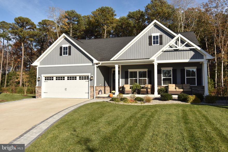 Nestled in the serene community of Seagrove, this exquisite coastal residence, built in 2021, offers a harmonious blend of luxury and comfort. With four spacious bedrooms and three elegantly designed bathrooms, this home is a sanctuary that invites relaxation and enjoyment. Step inside to discover an open floor plan that seamlessly connects the living, dining, and kitchen areas, creating an ideal space for both entertaining and everyday living. The heart of the home features a stunning kitchen equipped with upgraded countertops, stainless steel appliances, and a generous island that beckons culinary creativity. The combination of ceramic tile and laminate plank flooring throughout adds a touch of sophistication while ensuring easy maintenance. Natural light floods the interior through thoughtfully placed windows adorned with tasteful treatments, enhancing the warm ambiance. The living area serves as the perfect space for intimate gatherings or quiet evenings at home. The primary suite is a true retreat, boasting a luxurious suite bathroom with both a stall shower  along with two spacious walk-in closets that caters to all your storage needs. Outside, the property is equally impressive. The meticulously landscaped yard, complete with a lawn sprinkler system, provides a lush backdrop for outdoor activities. Enjoy the tranquility of nature as the home backs to trees, offering a peaceful view that enhances the sense of privacy. The expansive deck and porch area invite you to savor morning coffee or evening sunsets in a serene setting. The convenience of an attached two-car garage and additional driveway parking ensures that you and your guests will always have ample space. This home is not just a place to live; it embodies a lifestyle of comfort, elegance, and community. Experience the perfect blend of modern living and natural beauty in this exceptional property, where every detail has been thoughtfully curated to create a warm and inviting atmosphere. As part of the Seagrove community, residents can enjoy a variety of amenities including a sparking pool with a large deck area and pickle ball along with a large community center. Sellers will negotiate the sale of any furniture. The transaction will take place outside of closing.