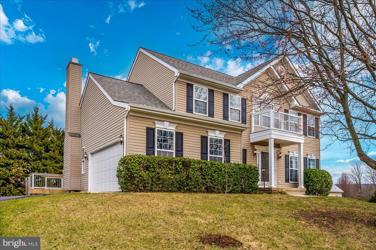 Welcome to this beautiful home offering 4 bedrooms, 3.5 bathrooms, and thoughtful design throughout.
Step into the grand two-story foyer with custom staircase railings and hardwood floors. The bumped-out breakfast room with a cathedral ceiling fills the space with natural light. The open kitchen features an island with a breakfast bar, while the family room boasts a wood-burning fireplace with a custom mantel. The primary bedroom includes a cathedral ceiling, a walk-in closet, and an en-suite bath with a soaking tub, a separate shower, and a double vanity. The finished walk-out basement offers a fifth usable bedroom and full bathroom—perfect for guests. Enjoy the deck with scenic views and peace of mind with a new roof (2018) and Water heater 2021
Prime Location with Local Charm. Located between Frederick and Hagerstown, this home is just 5 minutes from the Appalachian Trail and close to multiple state parks. It’s a 15-minute walk to Myersville Elementary School and near Martin’s Farm Market, local eateries, and community events like the annual Christmas tree lighting. With no HOA, stunning mountain views, and access to top-rated Middletown schools, this home combines small-town charm with modern convenience. Come see it for yourself!