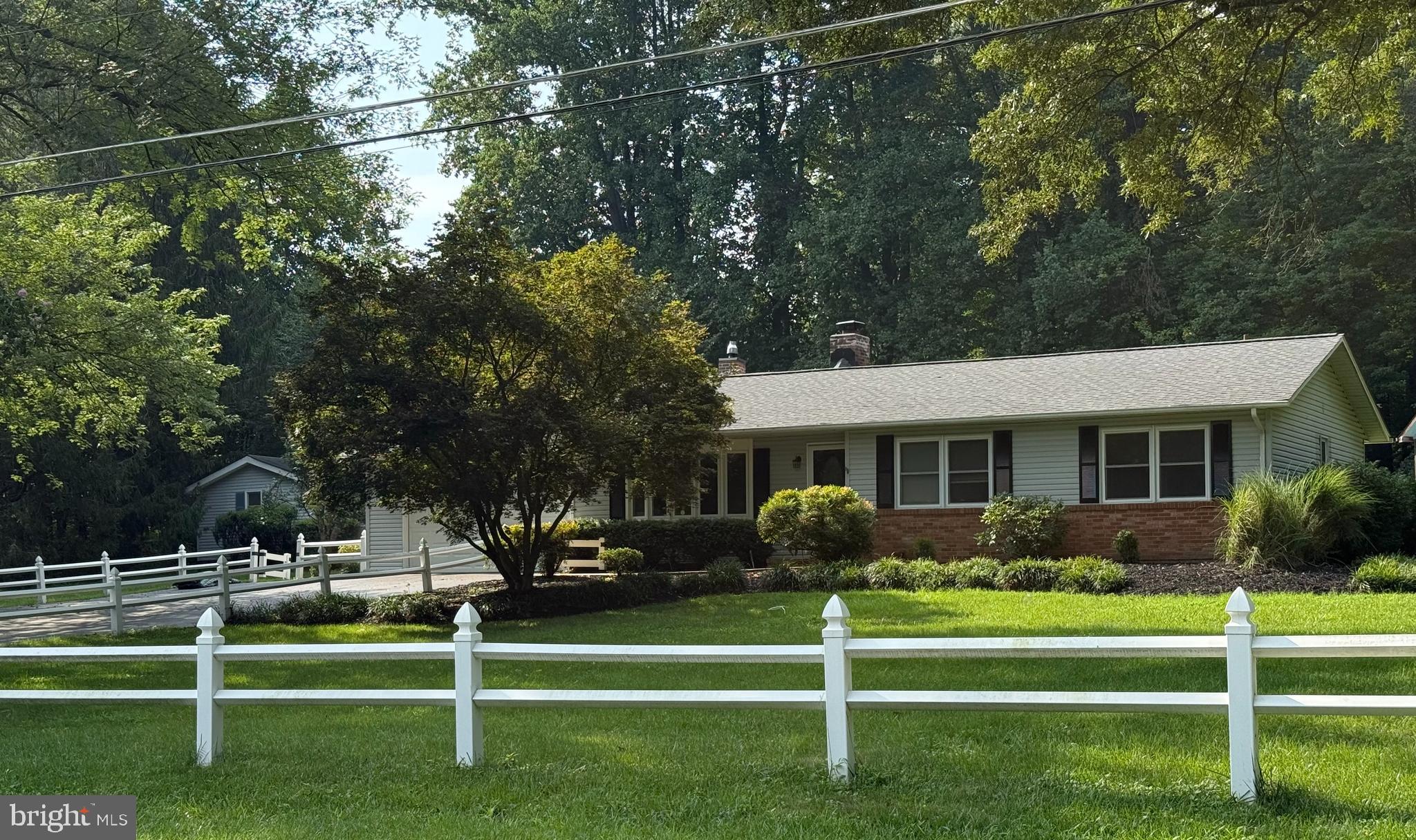 If you love entertaining, this property is for you!
This 3-bedroom, 2-bath rancher sits on a wooded 1.2-acre lot with a fully fenced backyard and everything you need to enjoy the outdoors: an in-ground pool, cabana bar, basketball court, horseshoe pits, hammock space, and an oversized picnic table—perfect for crab feasts and gatherings.
Inside features a 400+ sq ft sunroom with brand new LVP flooring, an updated kitchen, new ceiling fans in most rooms, and French doors that open to a dining area with a clear view of the pool.
Other highlights include a two-car garage with built-in workbench and heater, separate storage shed, smart front door lock, and single-level living for everyday convenience.