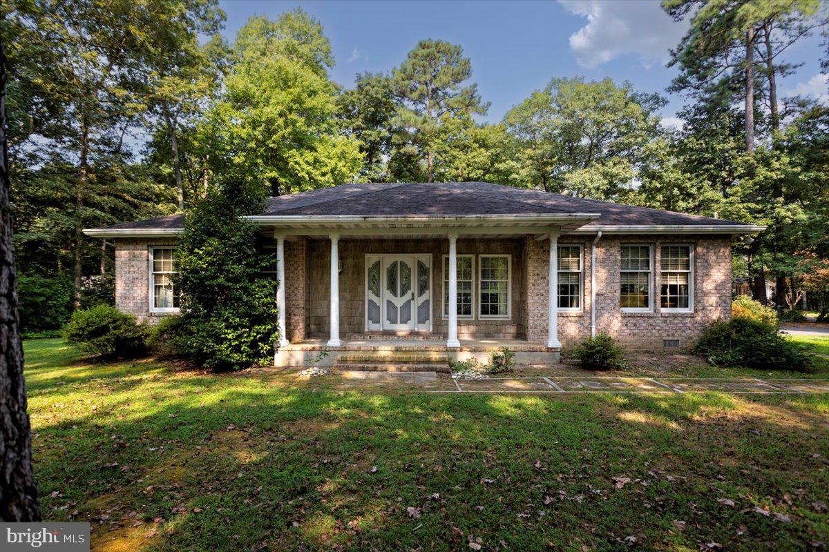 Welcome to this charming rancher nestled on a serene half acre wooded lot, offering the perfect blend of tranquility and convenience. This well maintained home features 2 or possibly 3 bedrooms, ideal for accommodating various living arrangements or a dedicated home office space. While the interior awaits your personal touch with updating and finishing touches, the property boasts a solid foundation and has been lovingly cared for over the years. Imagine transforming this space into your dream retreat, with ample room for expansion and customization. Located just moments from Caroline County Country Club(hosts weddings and private event, and has a driving range) and is a short drive to the vibrant town of Denton, this location promises both recreation and practicality. Enjoy easy access to golfing, community amenities, and everyday conveniences while savoring the peaceful ambiance of a wooded backdrop. Don't miss out on this opportunity to create your own haven in a sought-after neighborhood. Schedule a showing today and explore the potential that awaits! ****Being sold as-is and is part of an estate***,