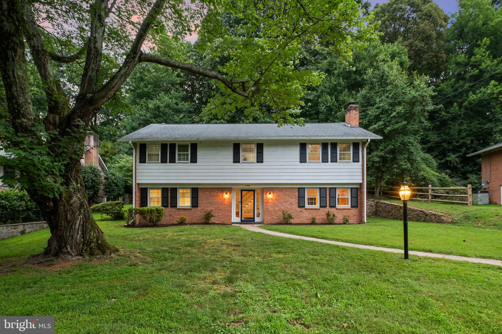 Tucked into a peaceful, wooded setting, this beautifully updated home features four spacious bedrooms, three full bathrooms, and a convenient half-bath, offering a perfect blend of comfort, functionality, and timeless appeal.
Step inside to a warm and inviting entry level. A generously sized family room anchored by a charming brick wood-burning fireplace sets the stage for relaxed gatherings. Just beyond, the spacious primary bedroom and a newly renovated full bath offer privacy and comfort—ideal for guests, multigenerational living, or a main-level retreat. A stylish new powder room and versatile bonus room add even more flexibility—perfect for a study, playroom, or creative studio.
Upstairs, the main level showcases the heart of the home, a stylish and modern kitchen, thoughtfully designed with sleek Quartz countertops, a large central island, and stainless steel appliances. Sliding glass French doors open directly to a stone patio and expansive deck, extending everyday living and entertaining into a tranquil wooded backdrop. Mature trees and natural surroundings ensure privacy, creating a true outdoor sanctuary.
An additional living space adjacent to the kitchen adds even more adaptability—ideal for a den, media room, or lounge. Throughout the home, brand-new recessed lighting highlights a mix of classic hardwood and modern engineered flooring, blending timeless appeal with thoughtful upgrades.