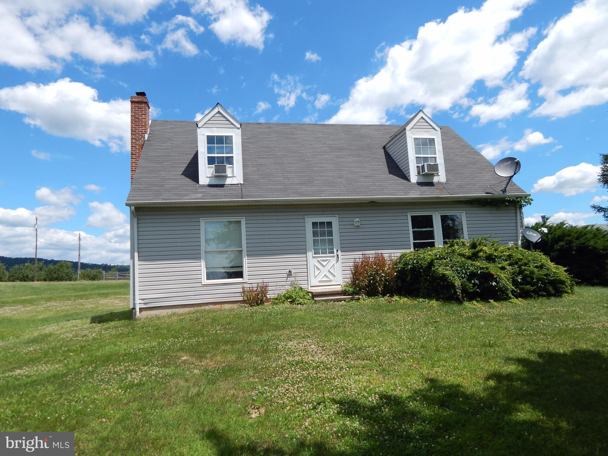 Great 4 bedroom home in country setting on level lot. Amazing views of the mountain and neighboring orchards. Ideal location to be away from the city, but close enough for all amenities. No water or sewer bills & priced to sell! Separate garage with office. Huge deck and plenty of ground surrounding home. Unrestricted and chickens are welcome.