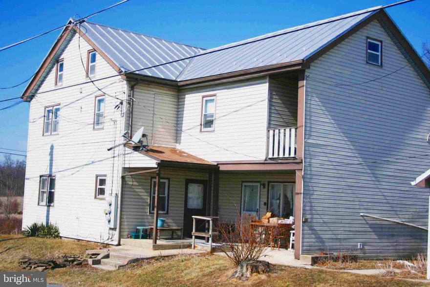 Upcoming Auction April 26th at 11a.m.
Vinyl Sided Two (2) Story Three (3) Unit House on 4.0+ Acres With Tillable Acres

UNIT #1 – 1/2 HOUSE:
Kitchen
 Living room
 Three (3) Bedroom Potential
  Bathroom
  Washer/Dryer Hook-Up
  Use Of Full-Size Attic
UNIT #2 – 1st FLOOR APARTMENT:  
Kitchen 
Living room
One (1) Bedroom
 Bathroom
 $650 Month + Electric
UNIT #3 – 2nd FLOOR APARTMENT:
 Kitchen
 Living room
 One (1) Bedroom
  Bathroom
  $850 Month + Electric

WOOD ORIGINALS METAL SIDED TWO (2) BAY GARAGE POLE BUILDING (24′ x 24′):
Service Door
Two (2) Roll-Up Doors (6’11” x 8’11”)
 Electric
 Metal Roof
 Concrete Floor
VINYL SIDED SUMMER KITCHEN W/ SERVICE DOOR (16′ x 25′):
Metal Roof
Soffit & Aluminum Spouting 
FRAME RUSTIC SIDED BUILDING (12′ X 14′)
OTHER REAL ESTATE DETAILS: 
Well Water w/ UV Light Treatment w/ Filters (Yearly Serviced By Martin’s Water Service)
Each Unit w/ Separate Water Heaters
Three (3) Electric Meters
 Standing Seam Metal Roof (Repainted w/in Last 5-Years)
 Soffit & Aluminum Spouting
 Concrete Walkway 
 Mature Shade Trees, & Shrubbery  
 Farm Ground Yearly Rental Fee $500