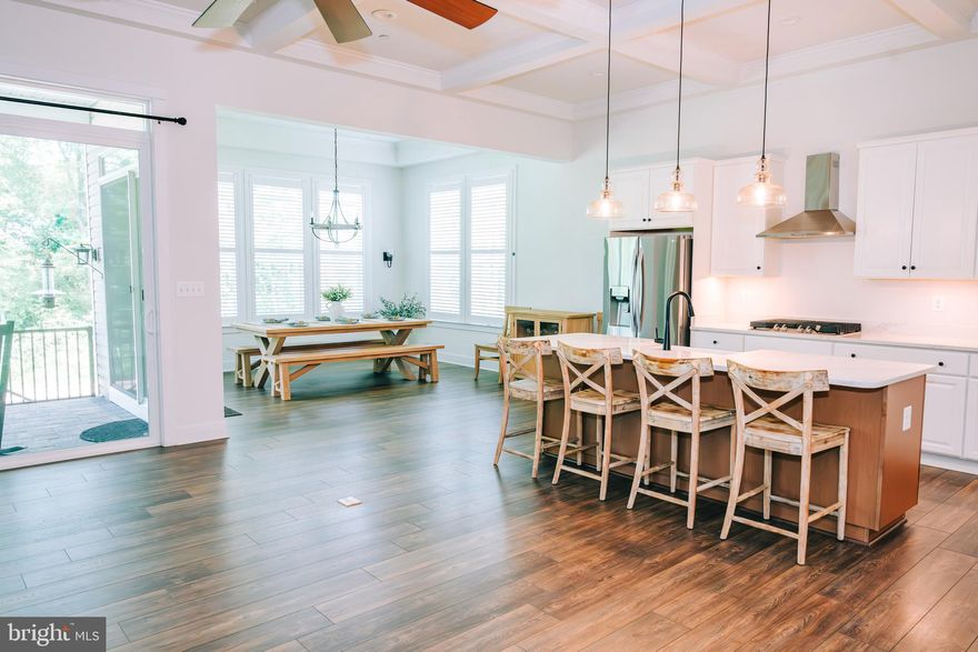 New Price - Over 3000 square feet of finished living space on 3 levels all in a neutral color palette.  The spacious main floor includes a bedroom &  full hall bath as well as a generous primary bedroom and bath. The gourmet kitchen with large island anchors the living & dining spaces with views to the farm beyond the treeline.  The main level was constructed with NO STEPS to enter from the garage. The garage entry has a large drop zone, coat closet, separate laundry room and large walk in pantry. The custom stone patio includes a gas grill, gas firepit & covered area for shade. Upstairs the owners added 2 bedrooms & 2 full bathrooms to the floor plan. The lower level is a full custom renovation with a large bar that features stainless appliances:  steam oven, microwave, dishwasher & refrigerator. The solid surface countertops & farm sink are a must see. The lower level also has plenty of unfinished space for storage and a walk out to the patio.  Enjoy a large single family home in a gated community conveniently located with access to Harford Rd, Rt 152, Rt 1 & i95.