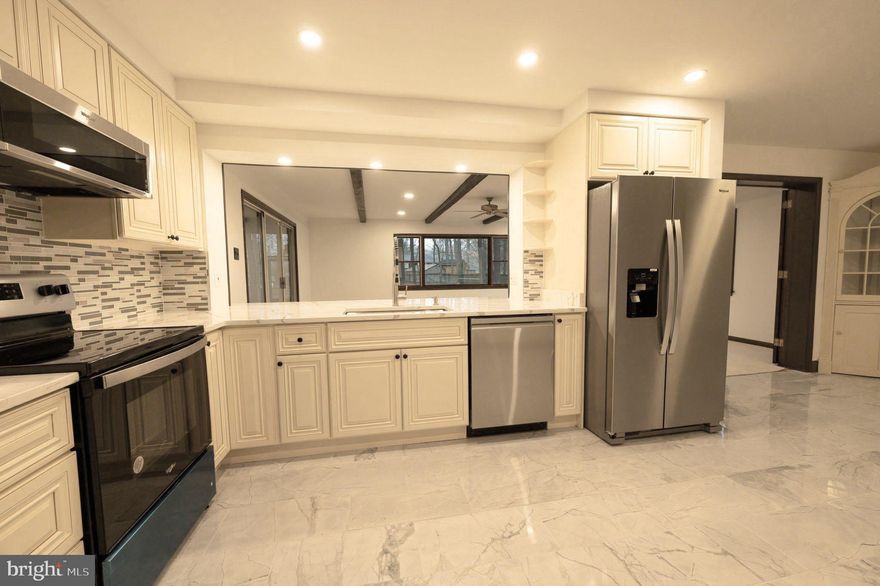 Comfortable, Spacious Updated Colonial with great Fairfax Location!  Outstanding Main Level Floor Plan w/ Formal and Informal Living Spaces, Gleaming Hardwoods, Wood Burning Fireplaces in both the Living Room and Library and Brand -New Kitchen opening to Dining Room and Huge Family Room.  Spacious Upper-Level Primary Bedroom with Hardwood Floors and En-Suite Full Bath.  Four additional nicely sized upper-level bedrooms.  Fully Finished Lower Level with Large Recreation Room and Bonus Room/Office.   Large Yard, Screened Porch, 2 Car Carport.  Ready for Move-In, Don't Miss this One!