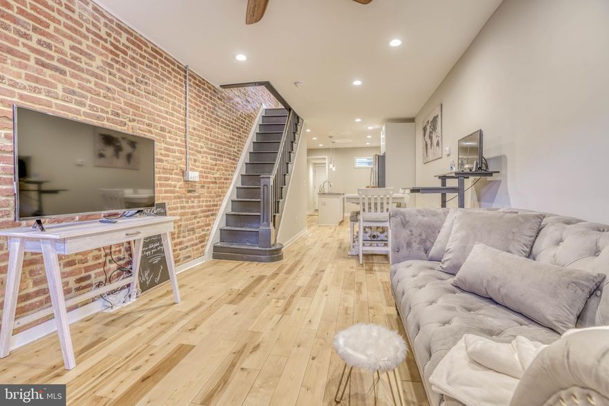 Welcome to 118 North Decker! An immaculately maintained interior row house that has all the bells for city living. When you enter, whether it's the front door that features your brick facade or the rear entrance that has your must have parking pad, you are sure to walk into light enjoying an open concept floor plan, hardwood floors throughout, a middle level laundry room and a delightfully open kitchen with an island. While traveling downstairs to the finished basement, you will see great open space for your entertainment needs or bedroom space as well as a fully finished bathroom. The upper level features 2 full bathrooms with one that is situated in the primary bedroom, making it a perfect owners suite. You can also find a deck for your outdoor enjoyment and the ability to create a rooftop deck in the future. Within minutes to i83, Patterson Park, Canton, John Hopkins and walking distance to local hot spots, North Decker will surely keep the Charm in Charm City. Take Advantage of the CHAP TAX CREDIT left on this property.