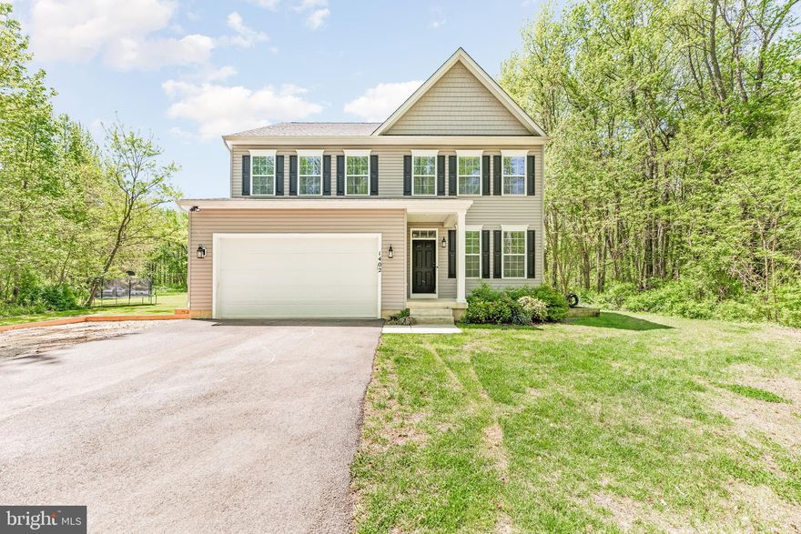Welcome to this beautifully maintained, newer Colonial (built in 2021) offering the perfect blend of modern design and peaceful privacy in Annapolis. Featuring 5 bedrooms and 3.5 baths, this home delivers the feel of new construction—without the wait.

Step inside to discover 9-foot ceilings and a bright, open-concept layout ideal for both everyday living and entertaining. The gourmet eat-in kitchen boasts a spacious island, seamlessly connecting to the inviting family room highlighted by a cozy gas fireplace. A convenient main-level bedroom adds flexibility for guests or multigenerational living.

Upstairs, you’ll find a generously sized laundry room and a luxurious primary suite complete with a private ensuite bath. The fully finished basement expands your living space with a large recreation area, den, and full bath—perfect for work, play, or relaxation.

Enjoy the outdoors from the newly built 18x18 deck overlooking a flat, half-acre lot that offers exceptional privacy. The backyard is thoughtfully designed with an above-ground pool and a dedicated fire pit area—ideal for gatherings year-round.

A newly completed walk and bike path nearby provides easy access to Sandy Point, downtown Cape St. Claire, and Anne Arundel Community College—an incredible amenity for an active lifestyle. Tucked just around the corner from Cape St. Claire, this property offers added space and seclusion while remaining close to everything Annapolis has to offer.

Schedule your private showing today and experience all this exceptional home has to offer!