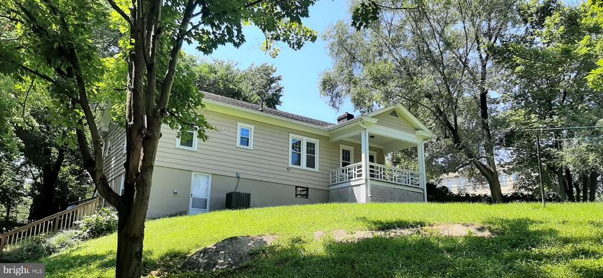 Premier location within walking distance to Historic downtown Shepherdstown with access to fine restaurants, shops, artistic venues, Shepherd University. Enjoy proximity to the Princess Street Boat launch with Riverfront Park.  Large corner lot. 1950 Raised Ranch on full unfinished walk-out basement. Beautiful hardwood floors throughout.. Freshly painted, New kitchen appliances, either nursery or large pantry off kitchen.   Oversized two car garage w/ built in workbench.  Formal Living Room/Dining Room.  Covered front porch with the sound of flowing water from the Town Run. Close to MARC Train commuter train at Duffields, C&O Canal Towpath.