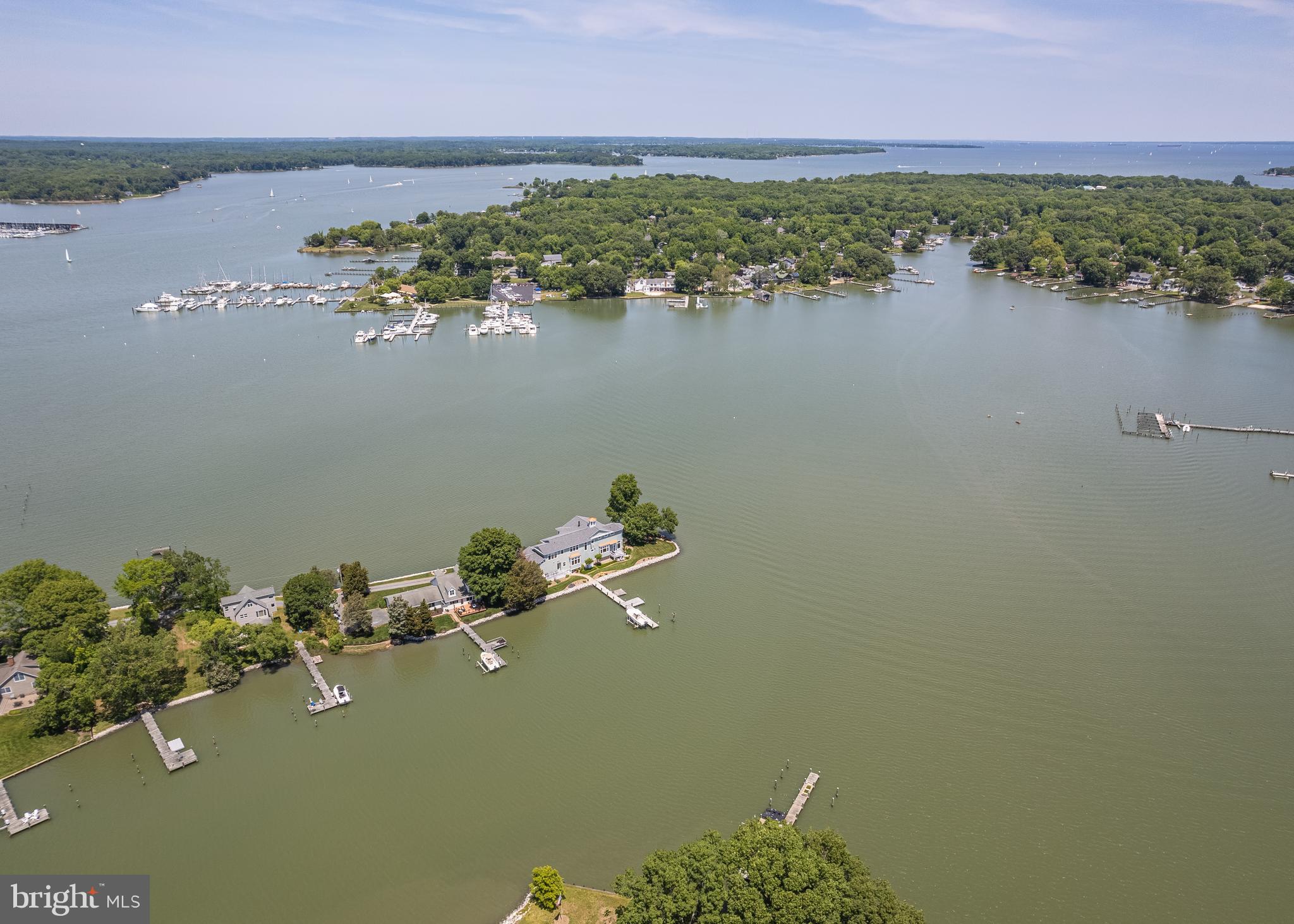 You said it HAD to be perfect. That you were NOT going to compromise. Good news! THIS is the one you've been waiting for, and it’s not every day that a home like this comes along. Perfectly positioned on a peaceful peninsula where the West River meets South Creek, this elegant retreat offers panoramic water views from every single room. No, really! EVERY. SINGLE. ROOM. From the moment you step inside, you’ll understand what we mean when we say: breathtaking.
Whether you're hosting lively gatherings, quiet evenings with close friends, or simply soaking in the serenity with a cup of coffee, this home is designed to be enjoyed. Start your mornings with the sunrise glistening over the water, right from your kitchen window. In the evenings, unwind in the glass-enclosed sunroom and watch the sun dip below the horizon—it's a front-row seat to nature’s nightly masterpiece.
Upstairs, you’ll find a generous 1,000-square-foot space ready for whatever your lifestyle needs—an artist’s loft, private guest quarters, au pair suite, retreat for your college student, or even an income-producing Airbnb. The possibilities are as expansive as the views.
If you've been searching for the rare blend of tranquility, luxury, and versatility in a waterfront home, this one checks EVERY box. If you were waiting for the PERFECT one with NO compromising, this is it.