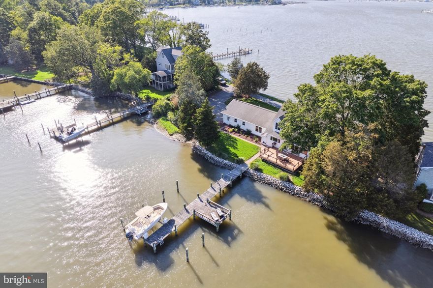 You said it HAD to be perfect. That you were NOT going to compromise. Good news! THIS is the one you've been waiting for, and it’s not every day that a home like this comes along. Perfectly positioned on a peaceful peninsula where the West River meets South Creek, this elegant retreat offers panoramic water views from every single room. No, really! EVERY. SINGLE. ROOM. From the moment you step inside, you’ll understand what we mean when we say: breathtaking.

Whether you're hosting lively gatherings, quiet evenings with close friends, or simply soaking in the serenity with a cup of coffee, this home is designed to be enjoyed. Start your mornings with the sunrise glistening over the water, right from your kitchen window. In the evenings, unwind in the glass-enclosed sunroom and watch the sun dip below the horizon—it's a front-row seat to nature’s nightly masterpiece.

Upstairs, you’ll find a generous 1,000-square-foot space ready for whatever your lifestyle needs—an artist’s loft, private guest quarters, au pair suite, retreat for your college student, or even an income-producing Airbnb. The possibilities are as expansive as the views.

If you've been searching for the rare blend of tranquility, luxury, and versatility in a waterfront home, this one checks EVERY box. If you were waiting for the PERFECT one with NO compromising, this is it.